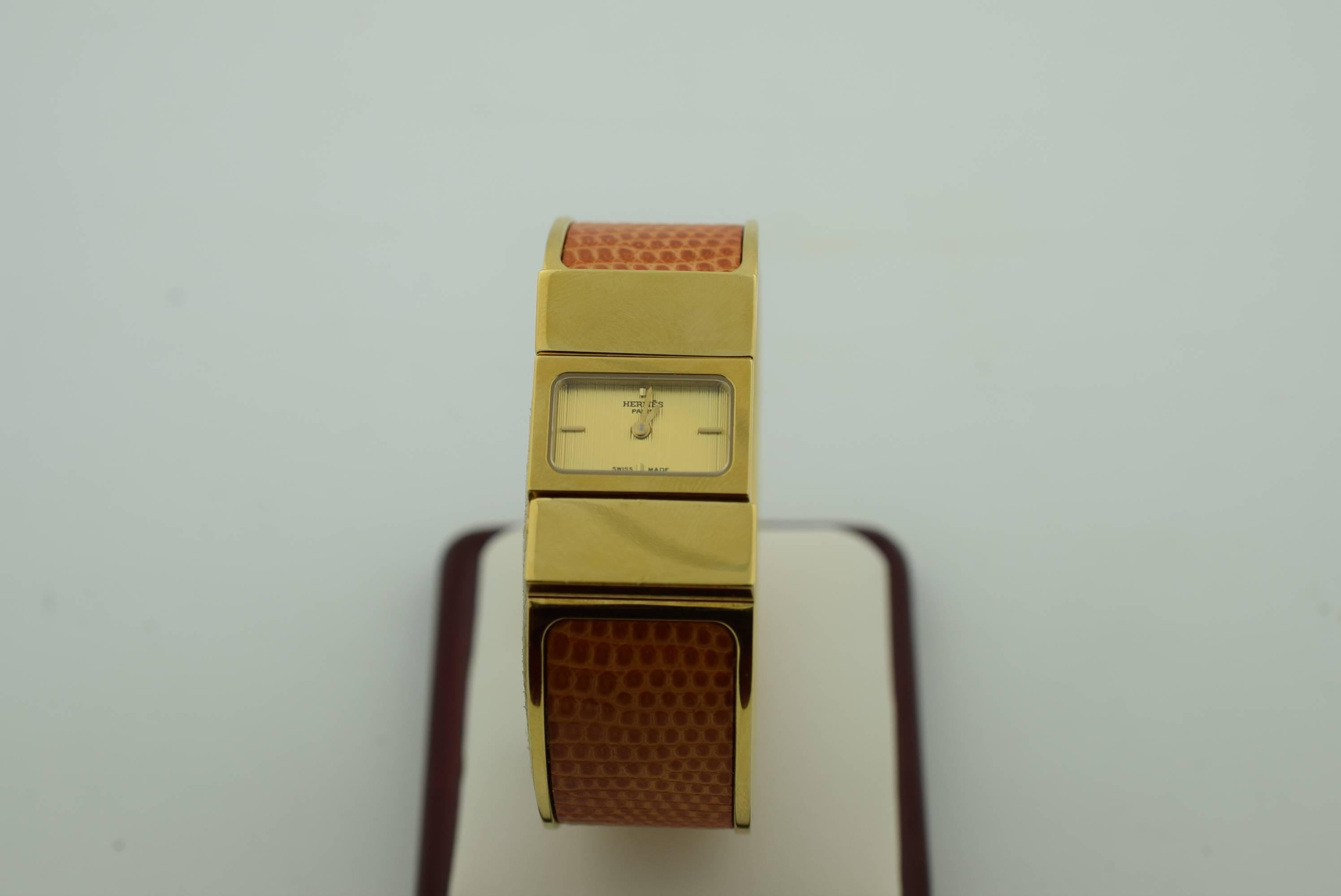 Monte Hermes model clack gold metal and brown lizard watch 
.Quartz Movement .
Model number :L.01.201.1019475.
Good Condition. No box - Velvet Pouch
fits small wrist 7