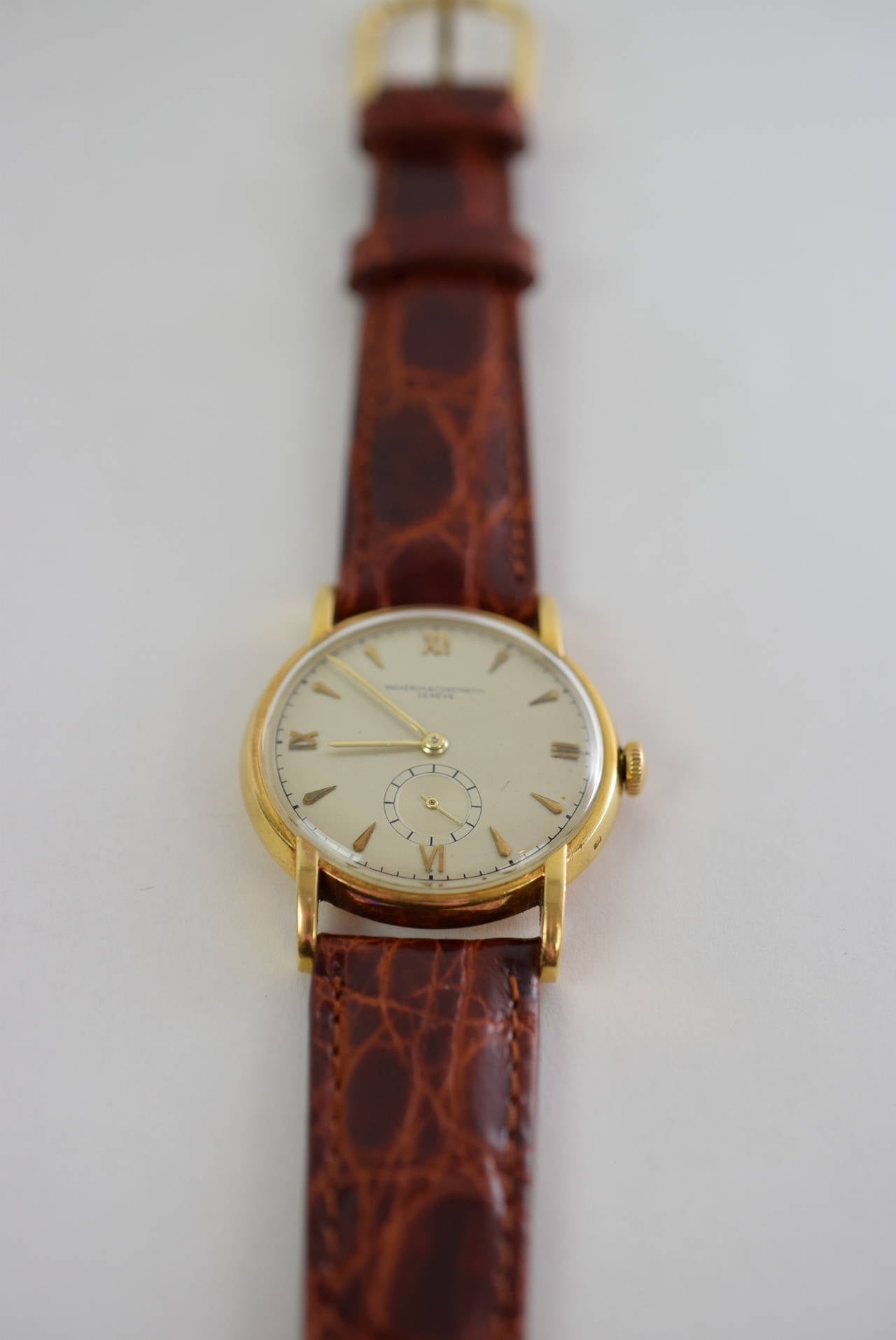 Vacheron Constantin 18K Yellow Gold, Manual Wind 1950s.
Very Good Condition. Original Dial Movement V 458.
De Beers Crocodile Strap Diameter 33.5 MM. 1/5/8 x 1 1/4.
Serial numbers: 3098xx. Warranted for one year from date of sale.