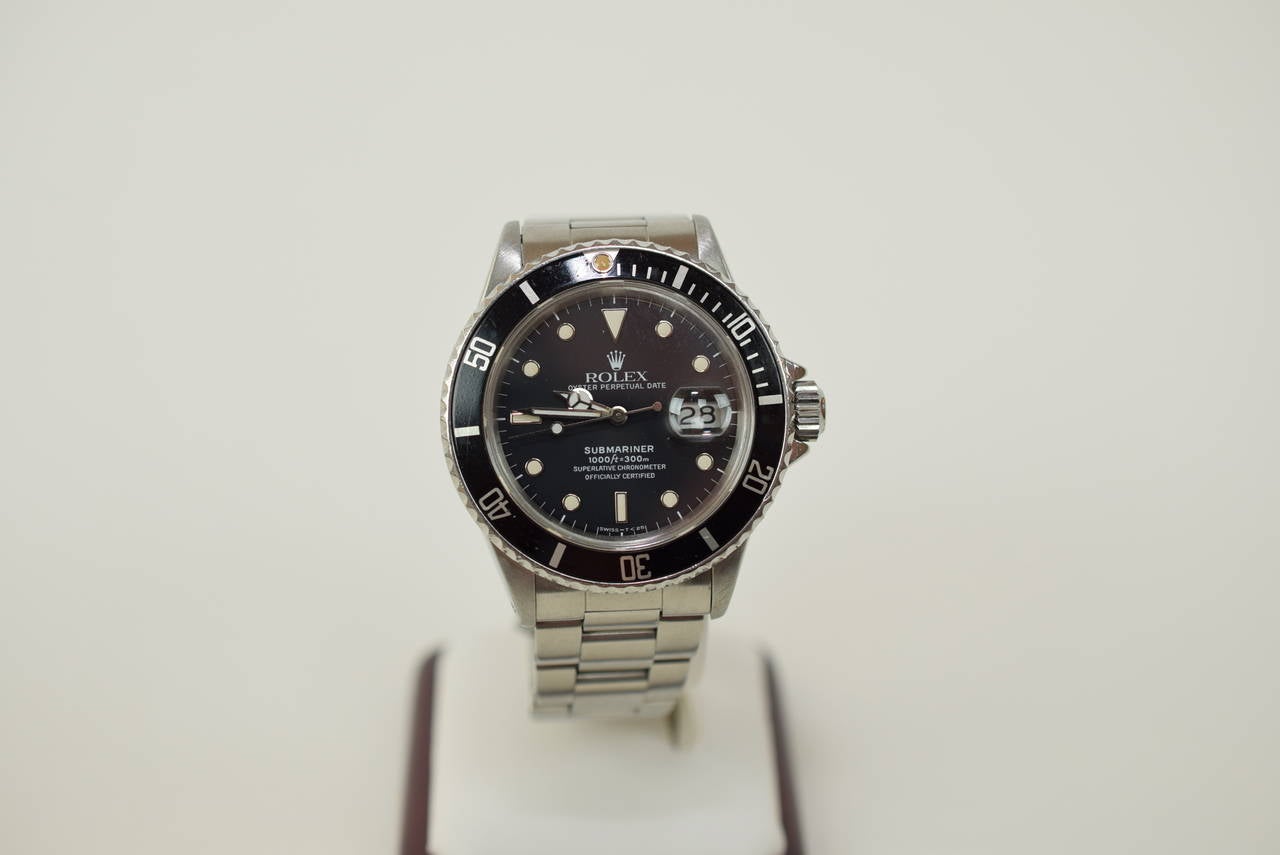 Rolex Submariner Date Stainless Steel Case Circa 1988.

Reference number 16800. Excellent condition and has the Submariner style flip lock band. Automatic movement. Serial number R5979. Comes with original Rolex inner and outer box, not shown in