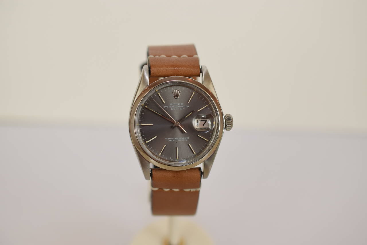 Rolex Vintage Stainless Steel Oyster Perpetual Date .Reference 1500 .
Original and Rare Dark Gray Dial .Automatic Movement .Chronometer Movement .Excellent Condition .Comes with Beautiful and stylish Brown Leather Strap and Stainless Buckle . Swiss