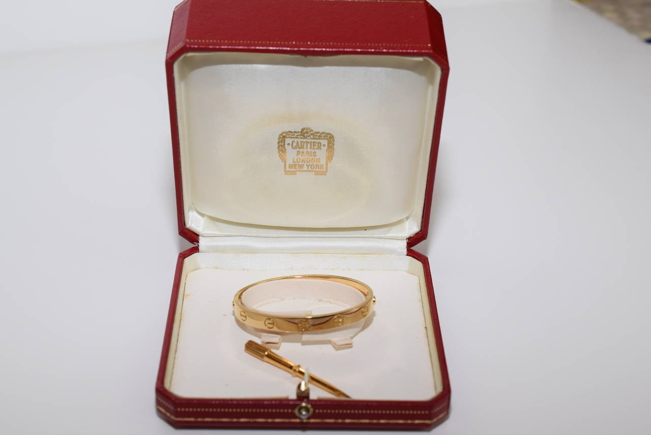 Cartier 18 K Yellow Gold Love Bracelet .16 Size.Made in France .Circa :1990,s .
In Excellent condition and comes with Original Cartier Box and guarantee card and screw driver .Serial numbers E 38925.