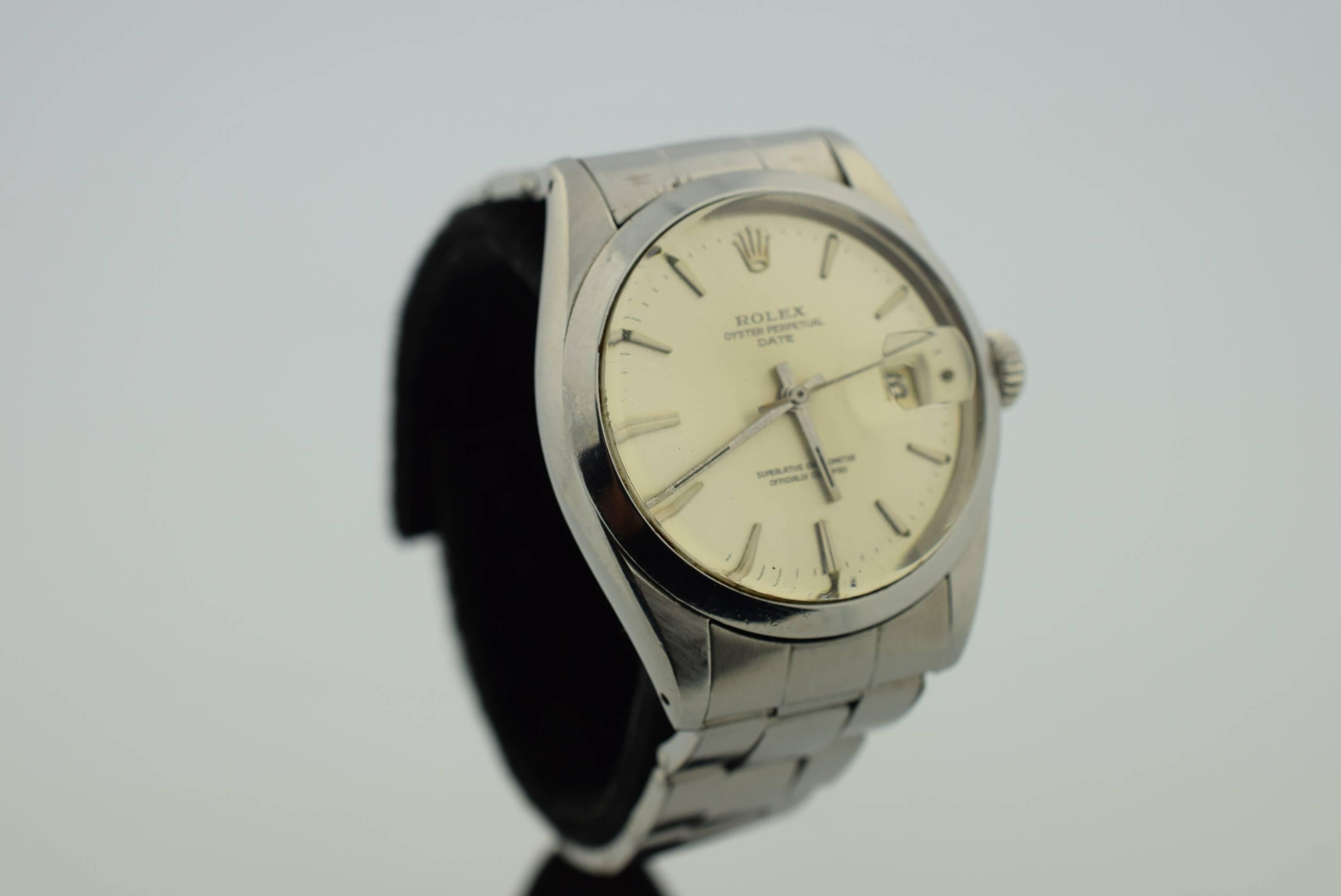 Rolex Oyster Perpetual Date .Model 1500 .Stainless Steel .Circa :1964-1965
Serial Numbers :1458628.Automatic movement. Silvered Dial with Silver hour markers .Oyster Type Band Original to Watch .Chronometer movement .
Swiss Made .Warranted for one