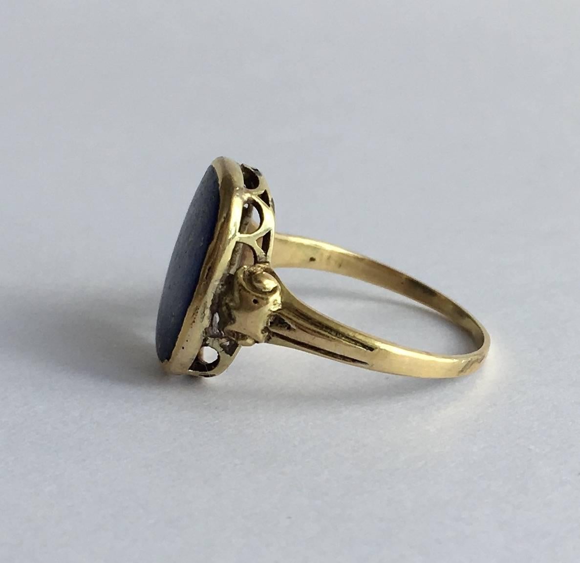 The lapis lazuli in this dainty gold signet ring has a magical quality, evocative of the night’s sky. The setting is stylishly done with elegant scallops. It is a dinky size, so perfect for a pinky. 

Size: UK I, US 4 ½ 