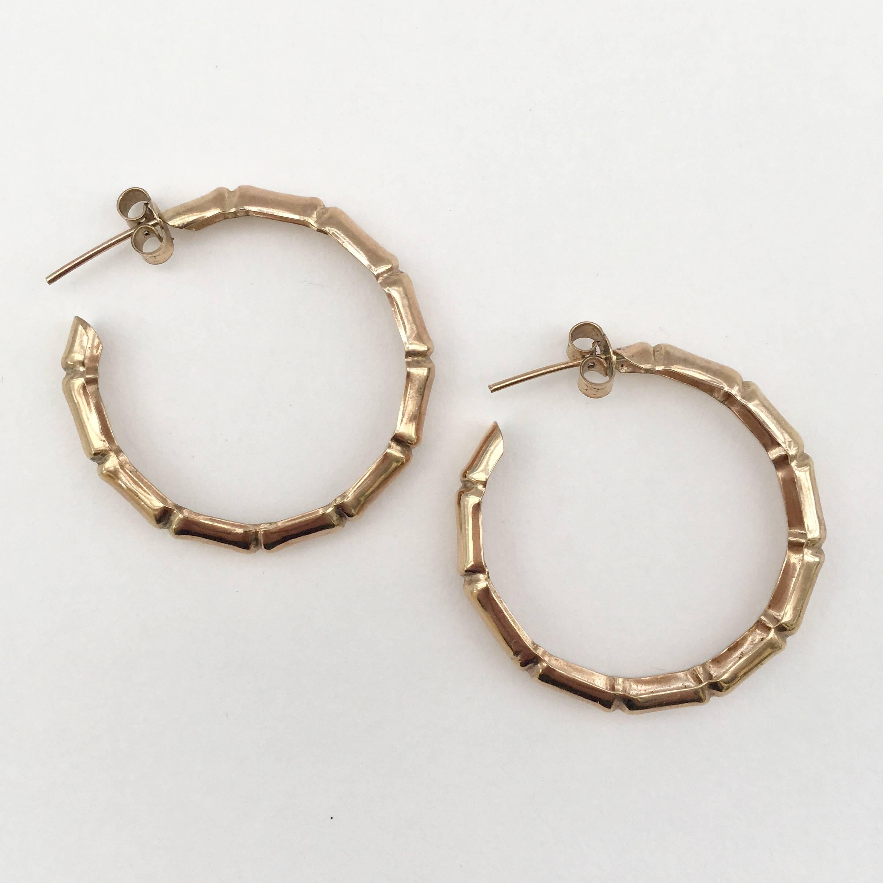 A classic pair of bamboo hoop earrings in delicate 9ct rose gold. These rare 1977 hoops are perfect in every way and will add a fashionable retro touch to any outfit. 