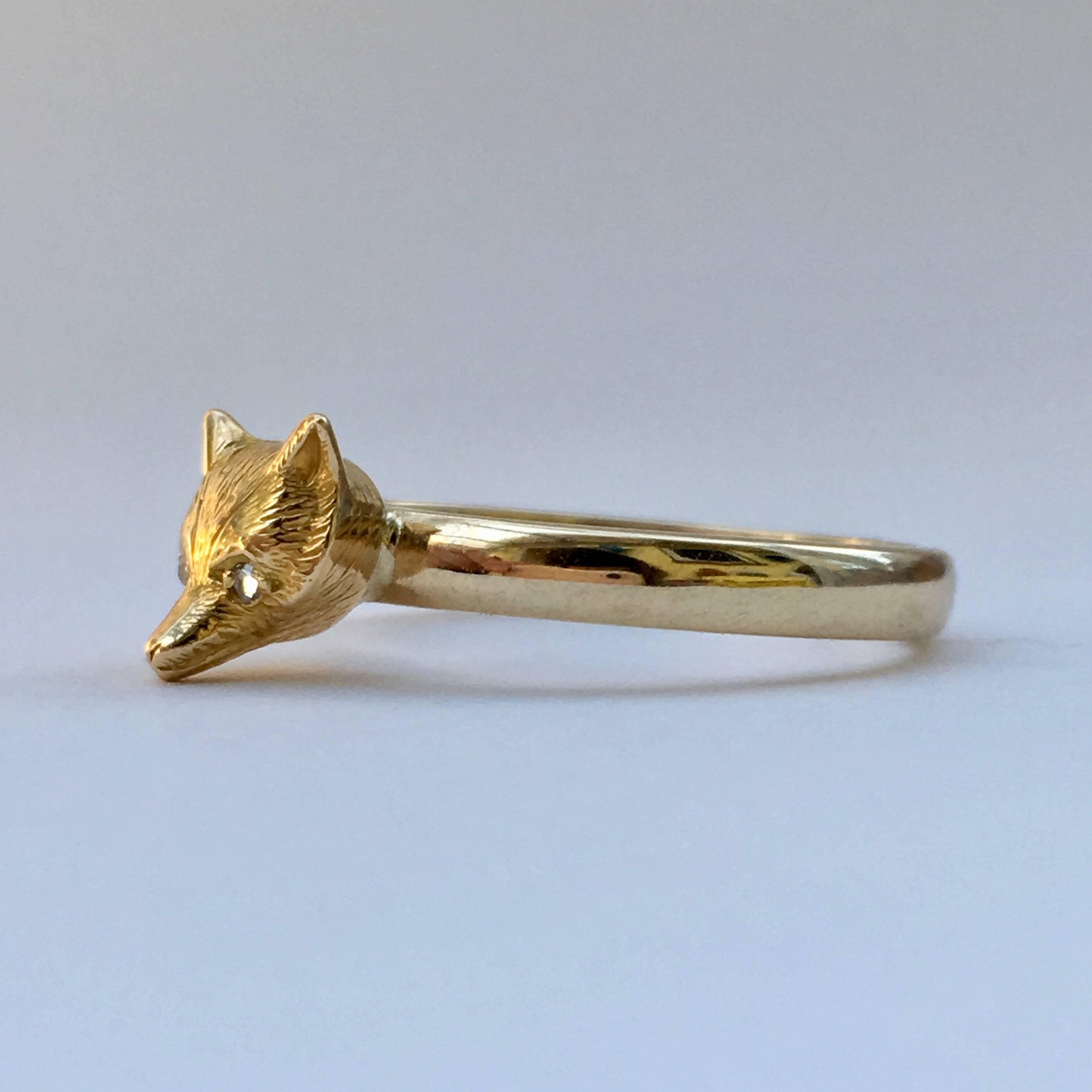 This sleek 9ct gold fox head started life atop an Edwardian gentleman's stickpin. The cunning and clever fox has long been a popular motif in jewellery, and this is a fine example with its sparkling rose cut diamond chip eyes and etched detailing.