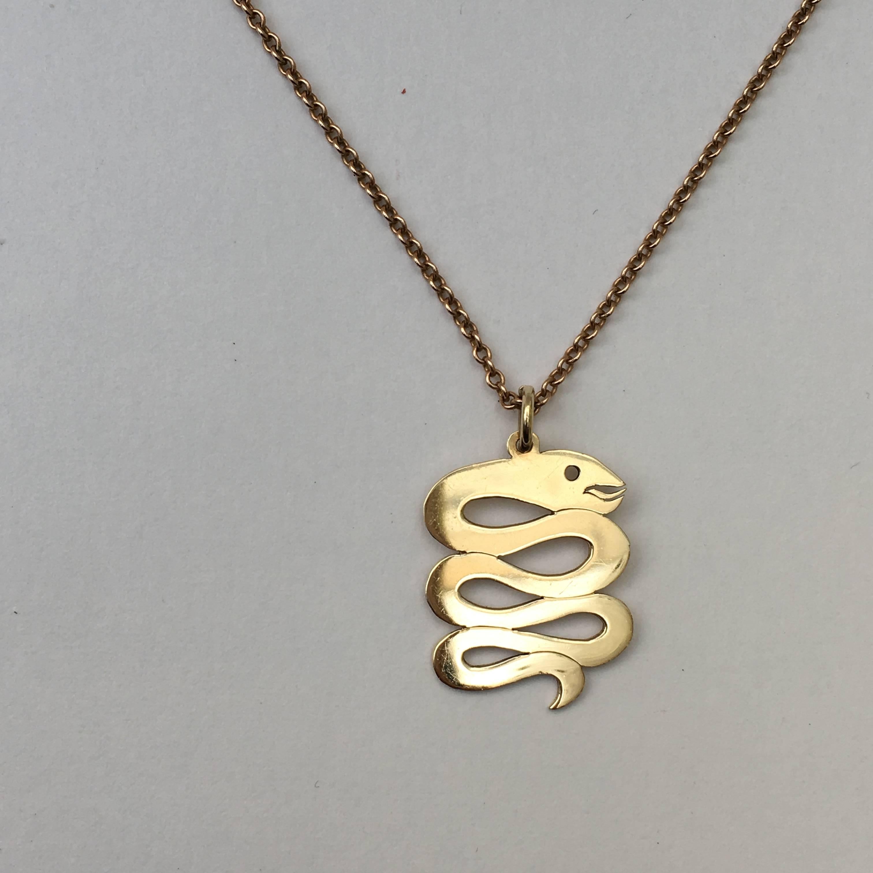 Snakes are revered in many cultures, thought to represent creativity, fertility and transformation. This 1970s 9ct gold snake pendant is full of character and would make a stylish addition to any charm collection. 

Size: 3cm x 1.8cm at widest