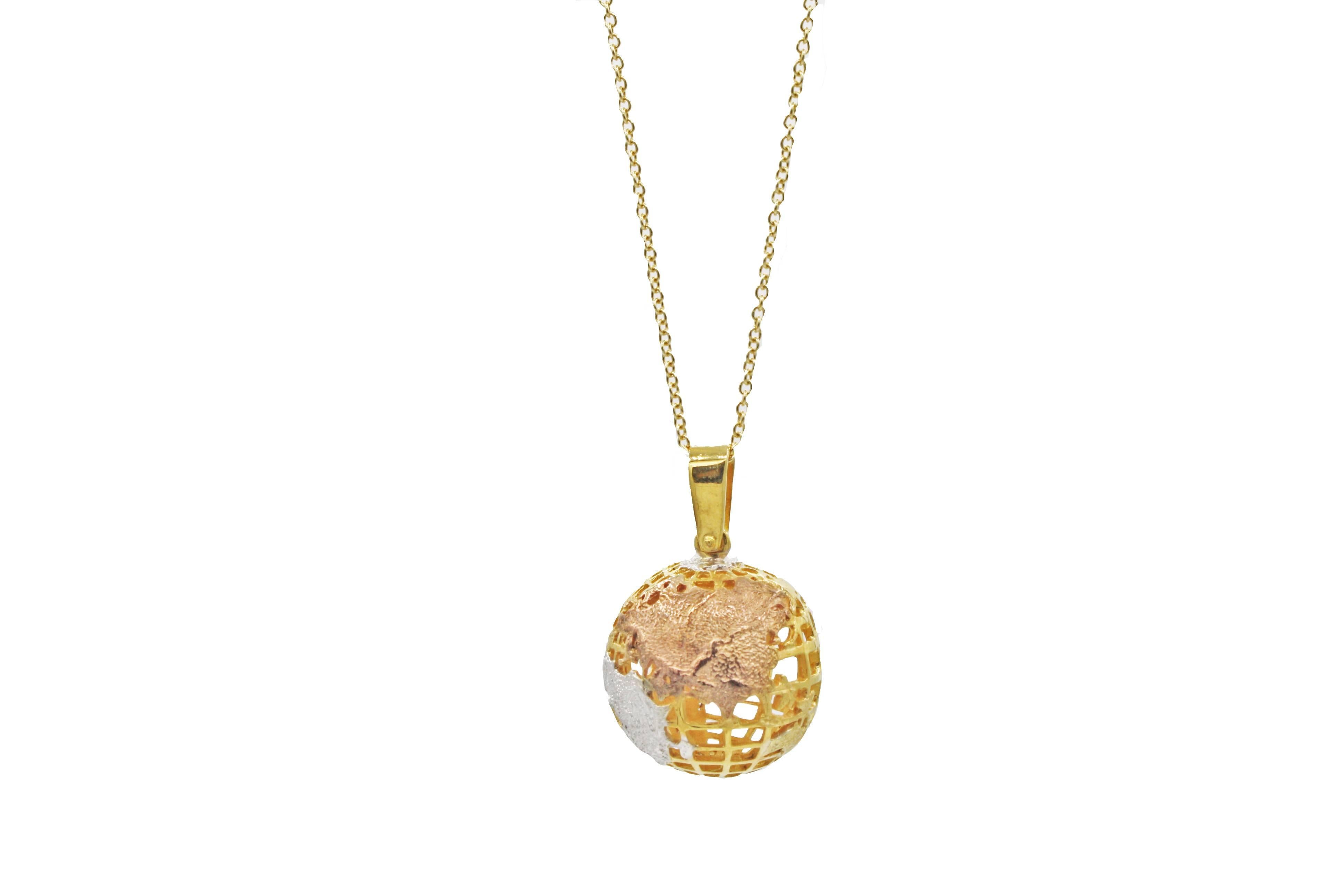 This pendant necklace features an 18kt yellow, white, and rose gold globe pendant, which has consistent, nice weight.  A playful piece that can be layered with other pieces.