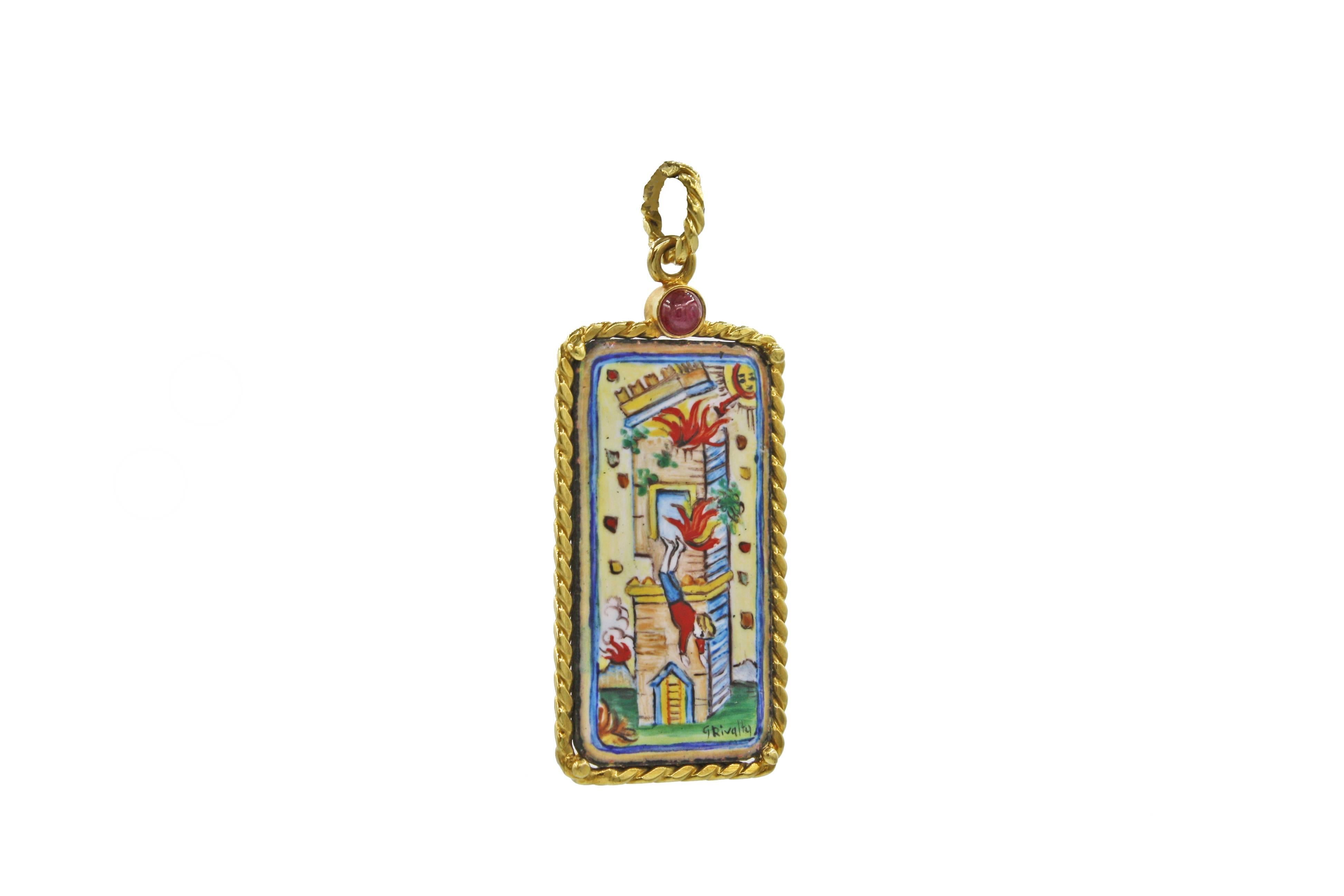 This rare, hand-painted enamel tarot card pendant is set in an 18kt gold frame with rope detailing.  Adding to its special qualities, there is a cabochon ruby set into the top of the pendant.  The tarot card pictured is the 