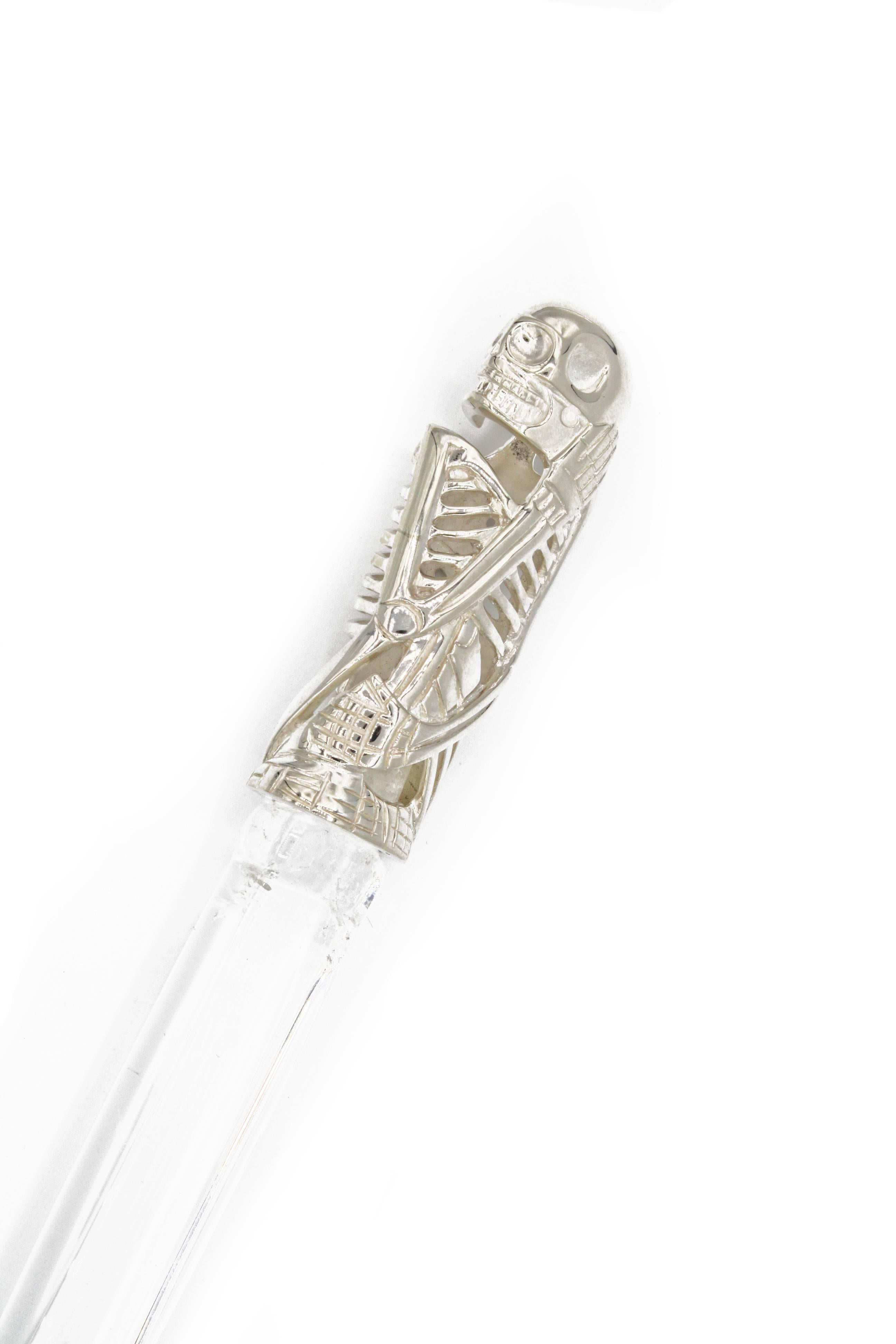 This stunning letter opener is made from natural Rock Crystal and Sterling Silver, featuring a skeleton handle.  A truly unique and sculptural desk piece or for the home.