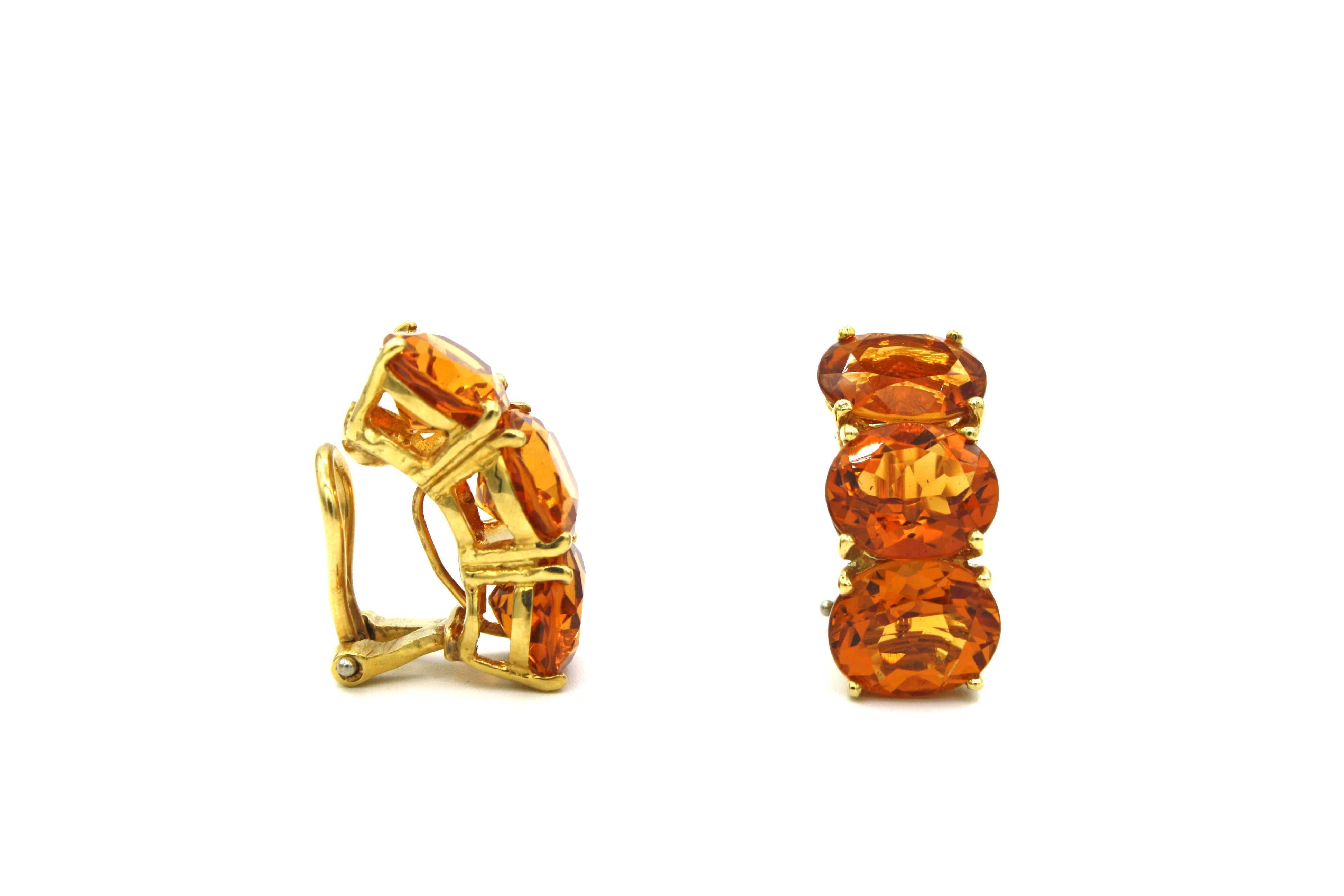 These stunning clip on earrings each feature three 3.4ct citrine set in 18k yellow gold in an arc available with posts in addition to the clips.  These bands of semi-precious stone are eye-catching and are an elegant statement signature to Renato