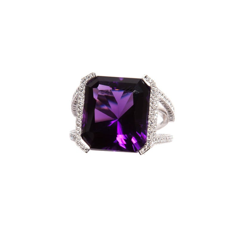 This stunning Renato Cipullo  Amethyst and diamond ring is set with a rich purple Asscher cut Amethyst weighing 15.82 carats in a Platinum setting with 3.50 carats of diamonds.
Size 7