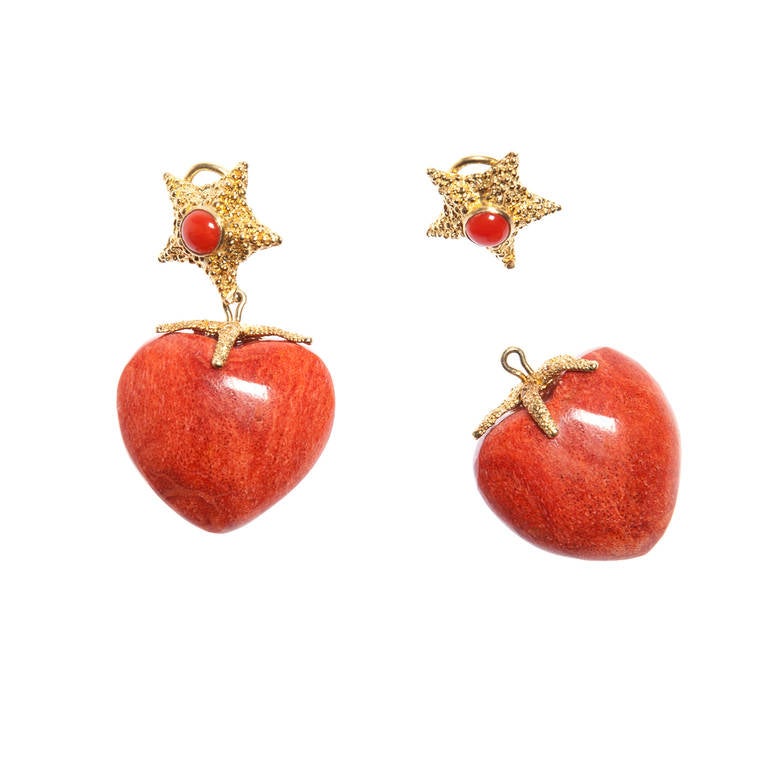 Natural Sea Coral hearts suspended from 18kt gold Starfish clips with center coral stone. The coral hearts are attached by a gold starfish and are detachable allowing the Starfish to be worn alone. 

Total length 2 inches
Coral Hearts are 1.16