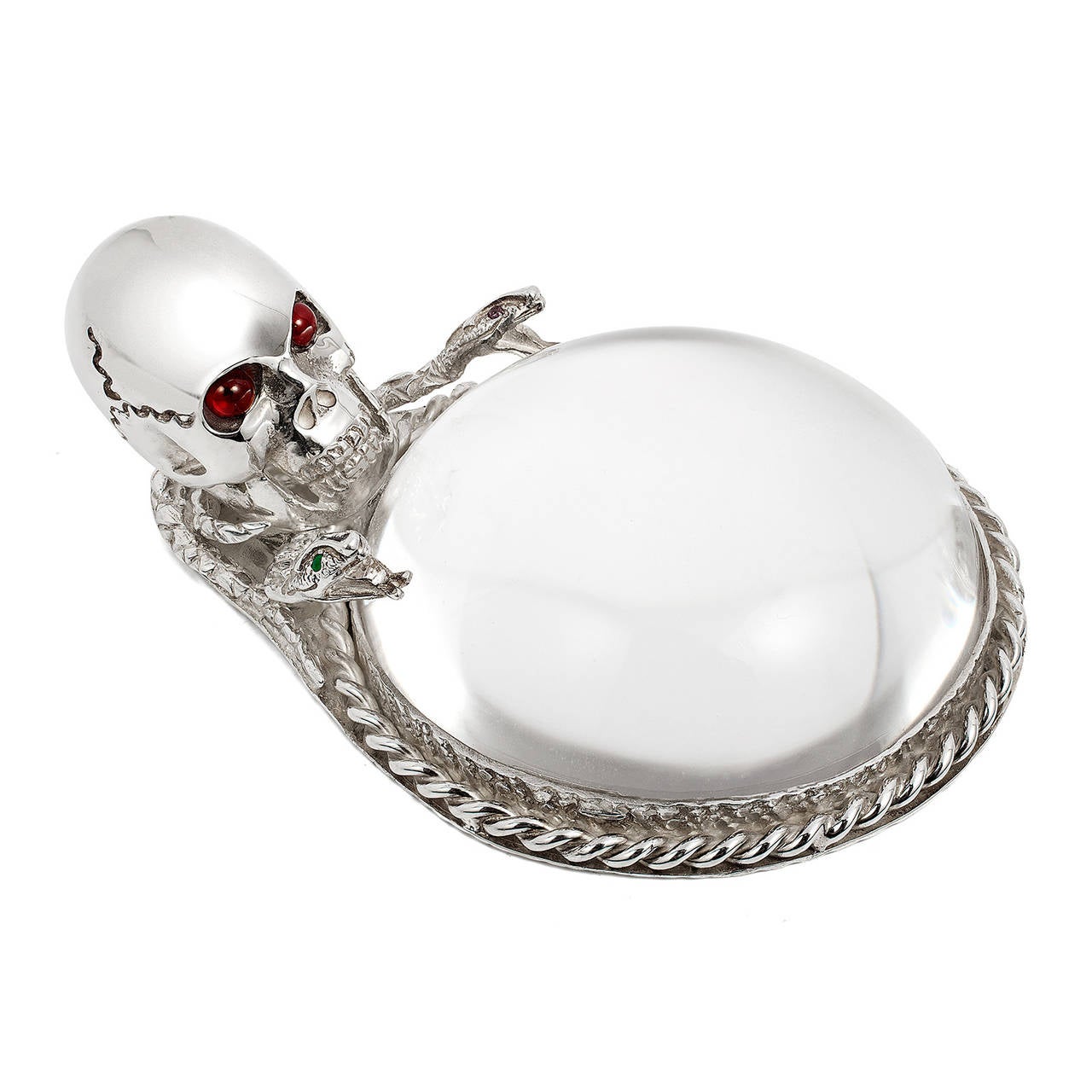 Striking sterling silver skull desk magnifier with cabochon ruby eyes by Renato Cipullo.  Snake with small emerald eyes and rope detail.