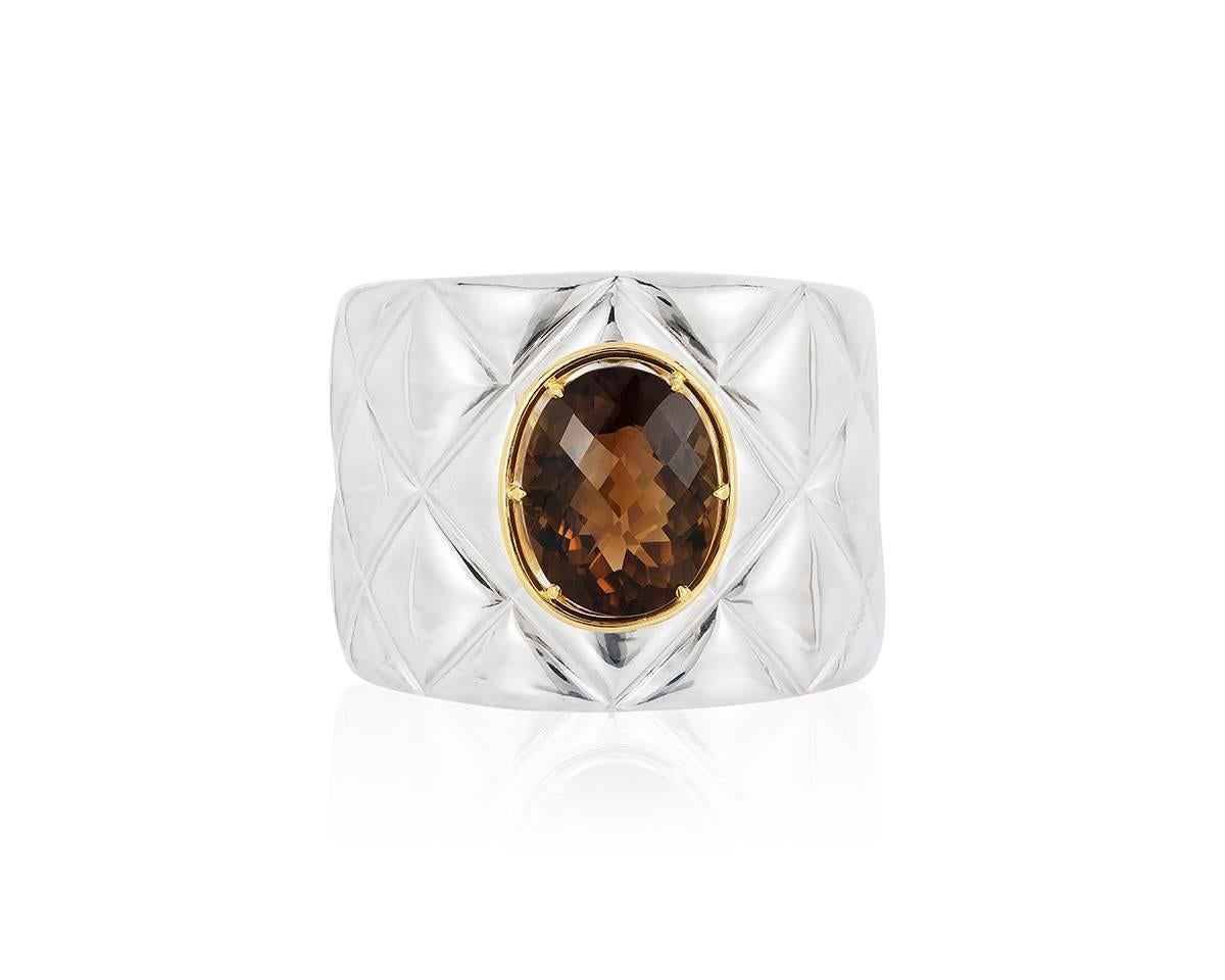 Sterling silver cuff set with 28.11ct oval champagne citrine in 18kt gold setting. A quilted diamond pattern on the cuff, this bracelet is an original Renato Cipullo design.