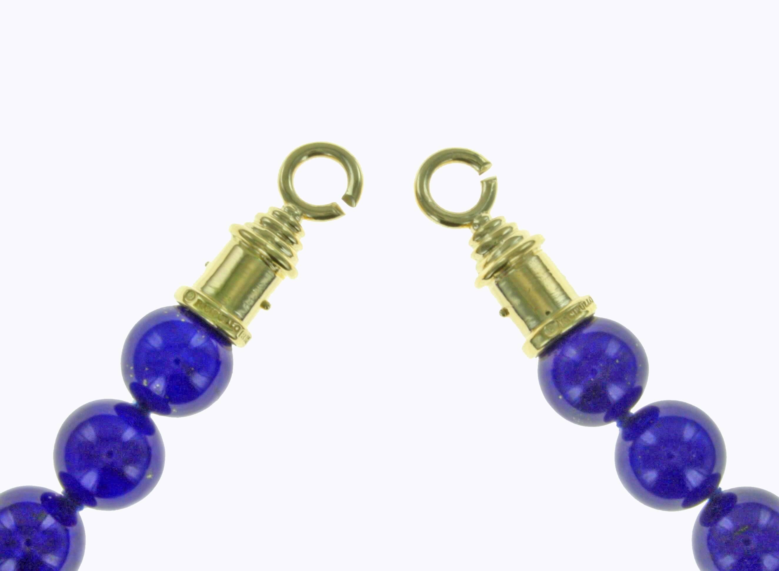 This exquisite necklace is made of 34 opulent lapis beads measuring 12mm with a unique gold clasp.  
Lapis is of exceptional quality AAA