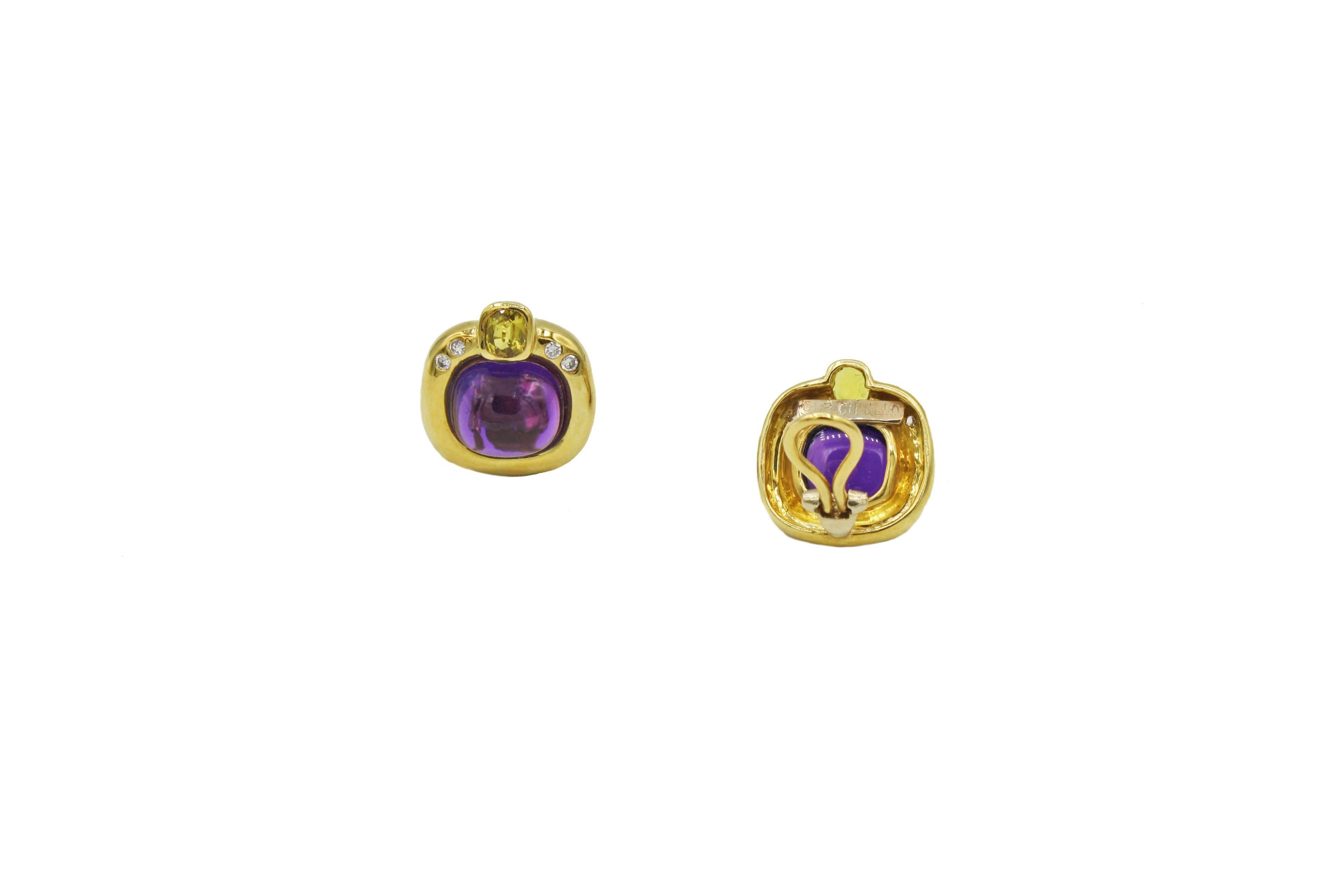 These classic 18kt yellow gold  earrings have .32 ct diamonds (G color, VS clarity), yellow sapphires, and cushion cut amethyst in the center.  
