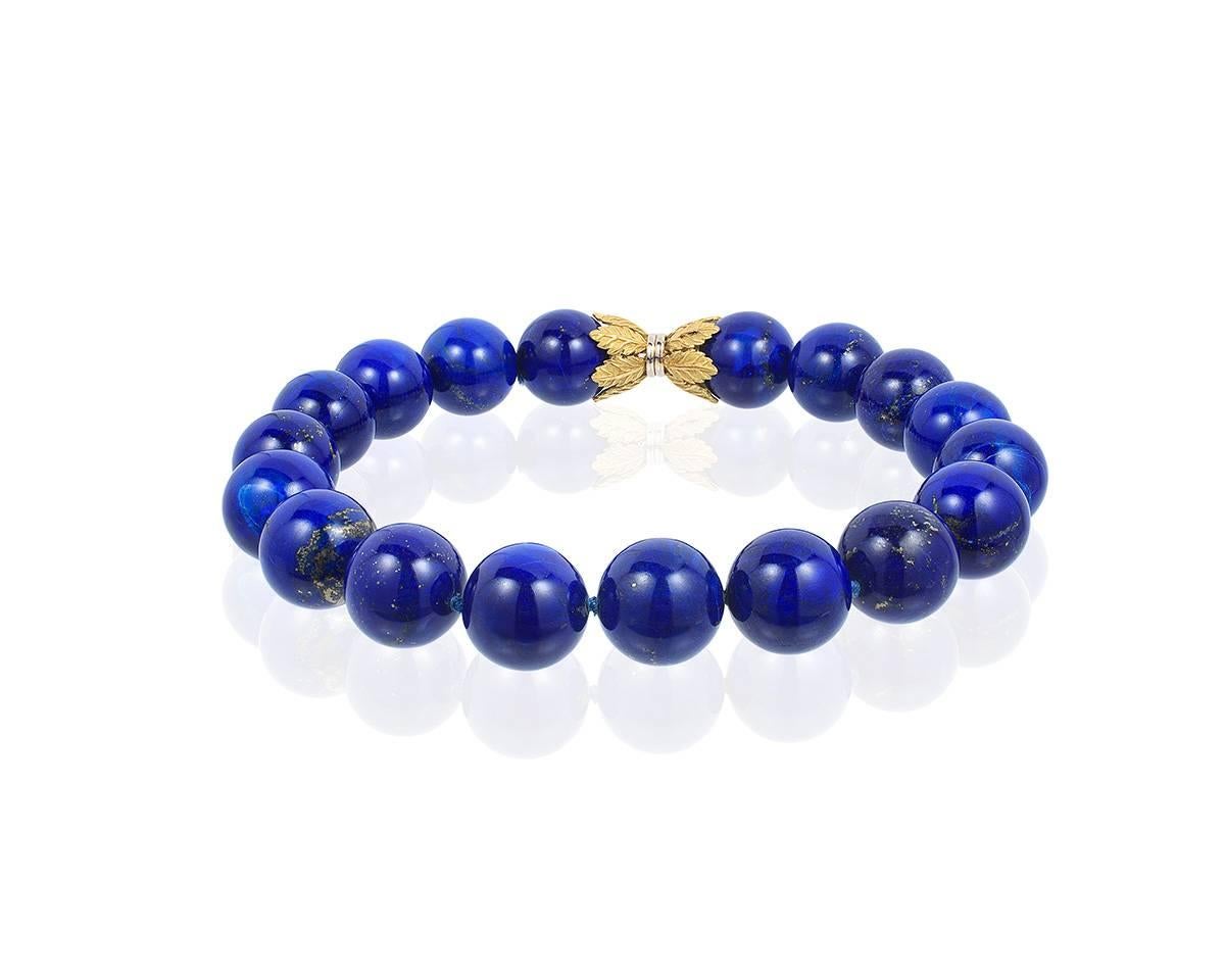 Opulent Lapis necklace, 18 22mm. lapis beads with an 18k yellow and white gold leaf motif clasp.
Lapis is of exceptional AAA quality.