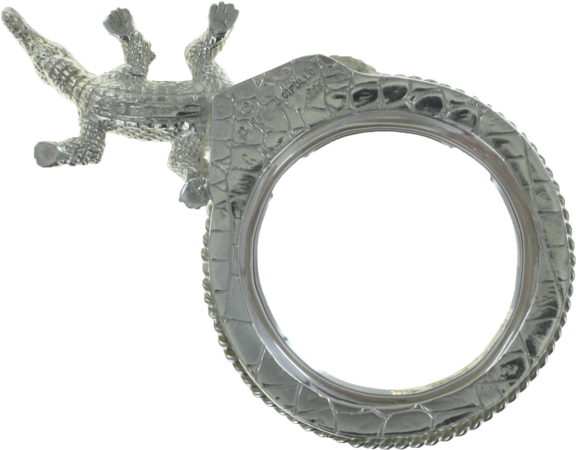 Striking sterling silver alligatorl desk magnifier with round cut ruby eyes by Renato Cipullo. 