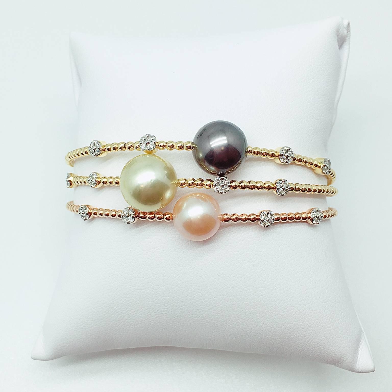 Tahitian Pearl: 11.8mm
White Diamond: 0.19 carat
Set in 18K Yellow Gold

Matching bangles with Gold southsea pearl and freshwater pearl also available.