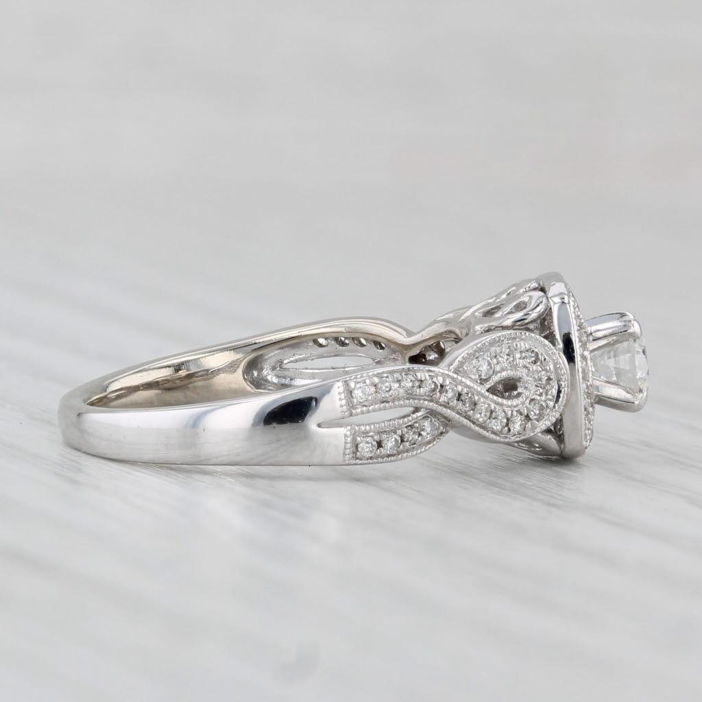 da uomo o donna Anello di fidanzamento aureolato con diamante rotondo da 0,55 carati in oro bianco 14k, misura 6,75 in vendita