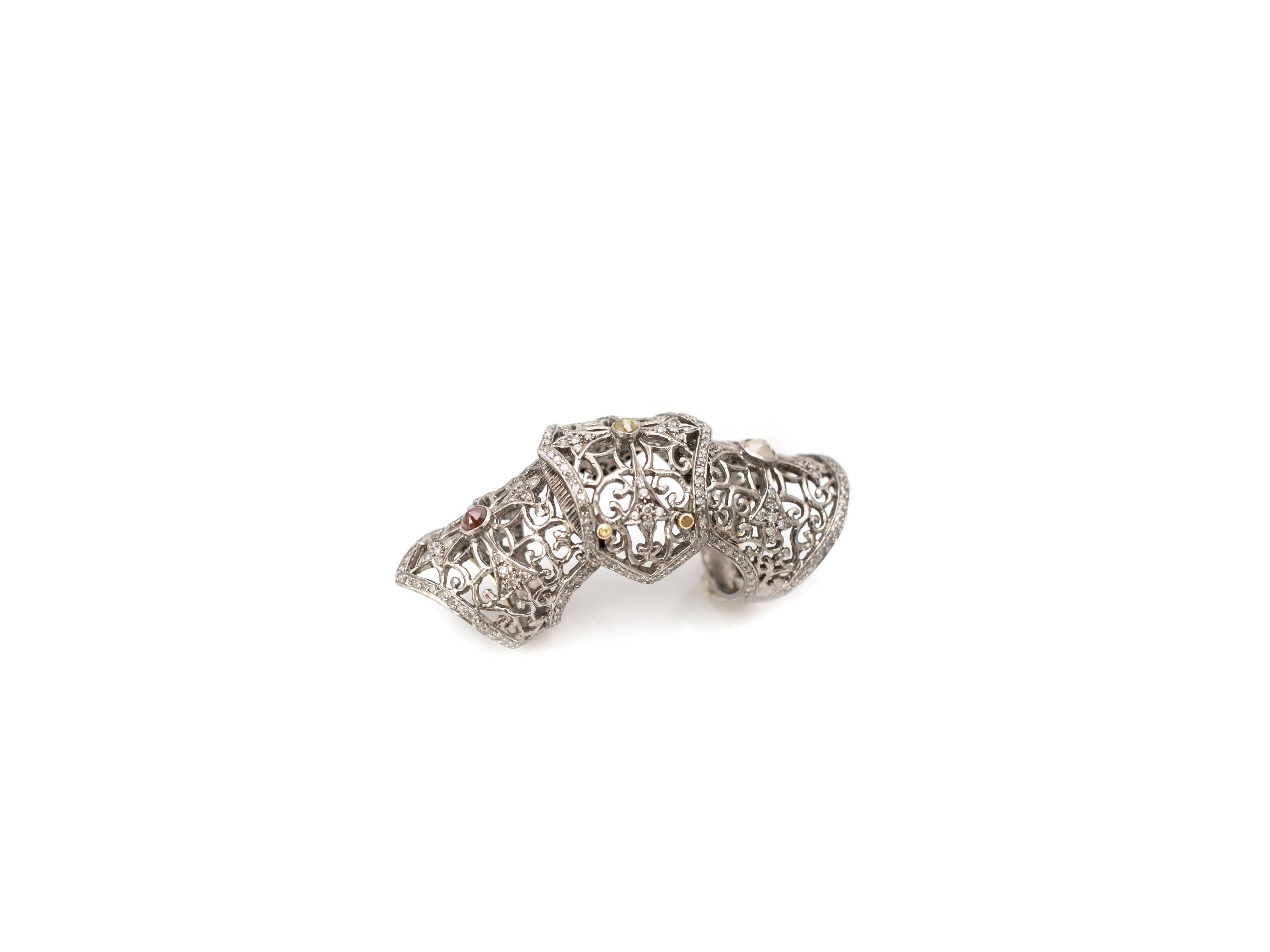 The diamond Knight Armor Ring by designer Samira13 utitlizes pave diamonds for modernity and rose cuts for a touch of Old World charm. The ring contains 3.5 carats of champagne diamonds set in sterling silver. Ring Size 6.5.
