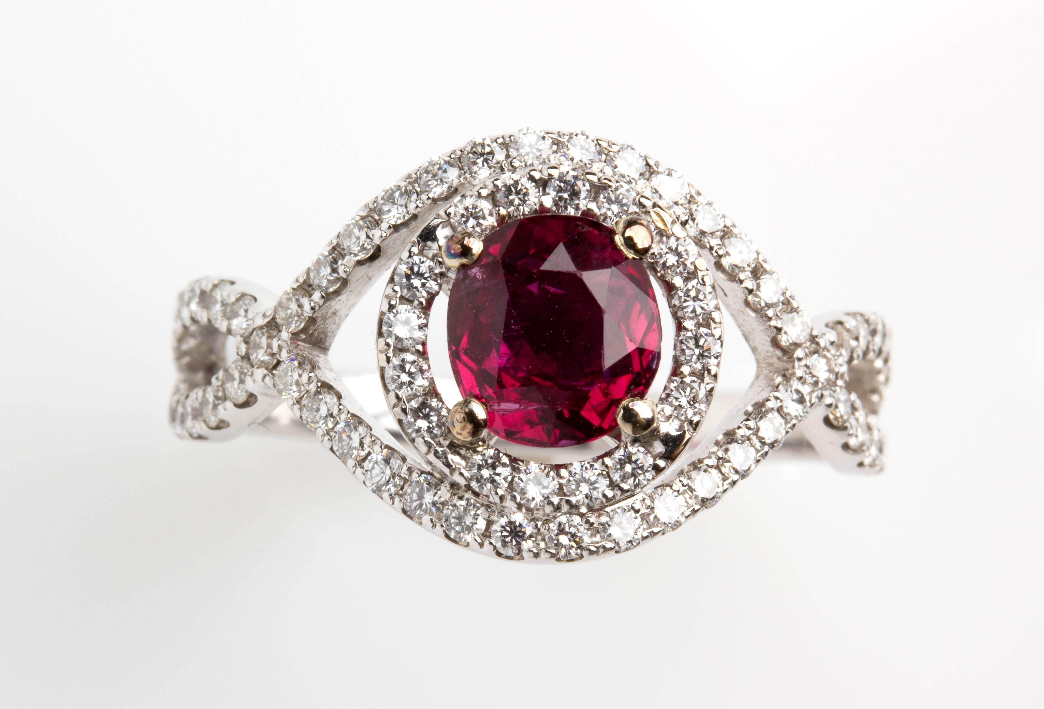 Set with a 1.50 ct ruby, surrounded by bands embellished by seventyfour brilliant cut diamond, G/H color, VS clarity, weighing 0.80 ct. Size US 8. Italian assay mark 750. Weight 4.5 gr.
Item ocndition grading: **** good.