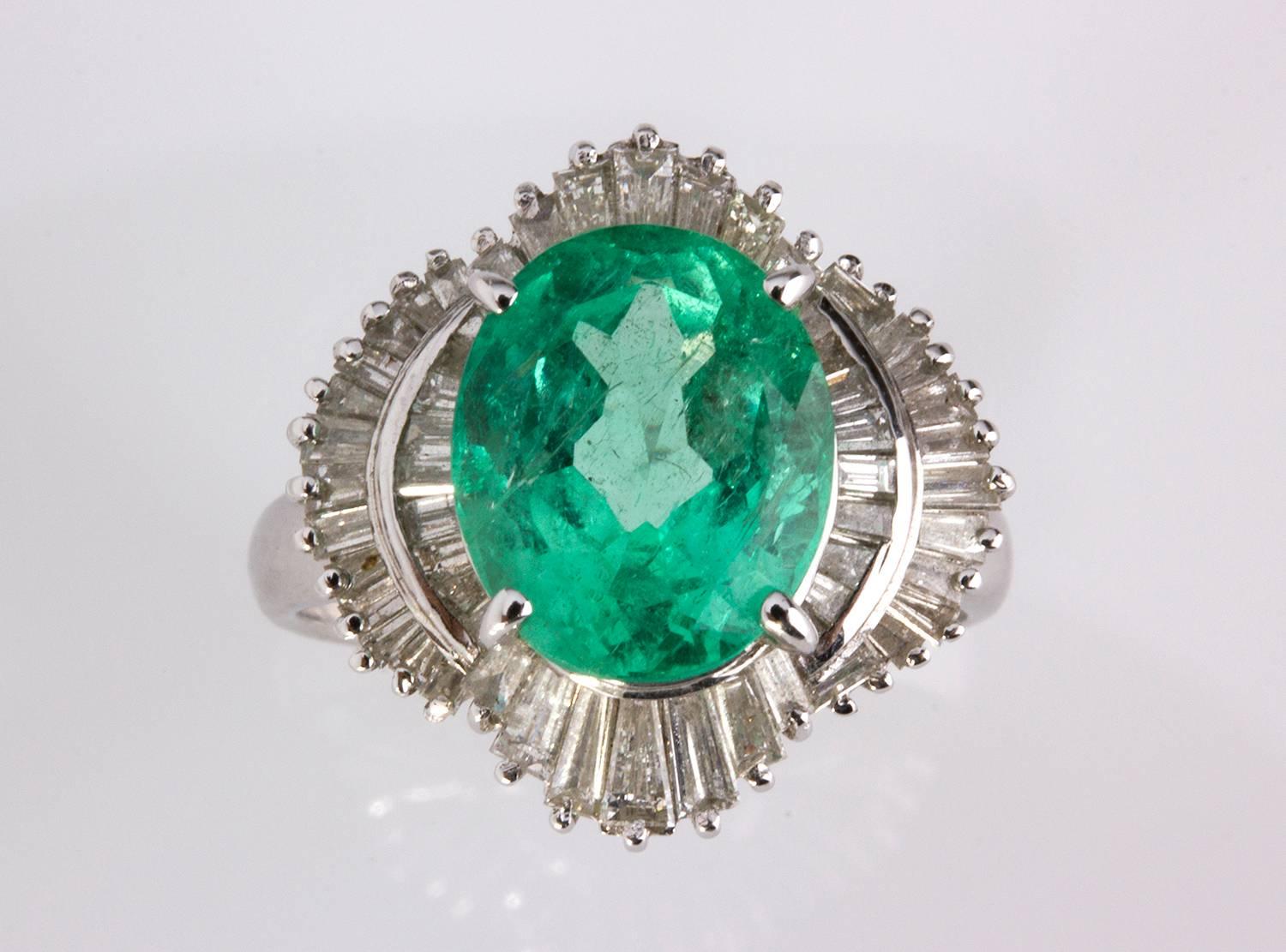 Set with an oval cut emerald weighing 3.67 ct, framed by baguette and tapered cut diamonds. Size US 6. Weight 6.2 gr. Item condition grading: **** good.