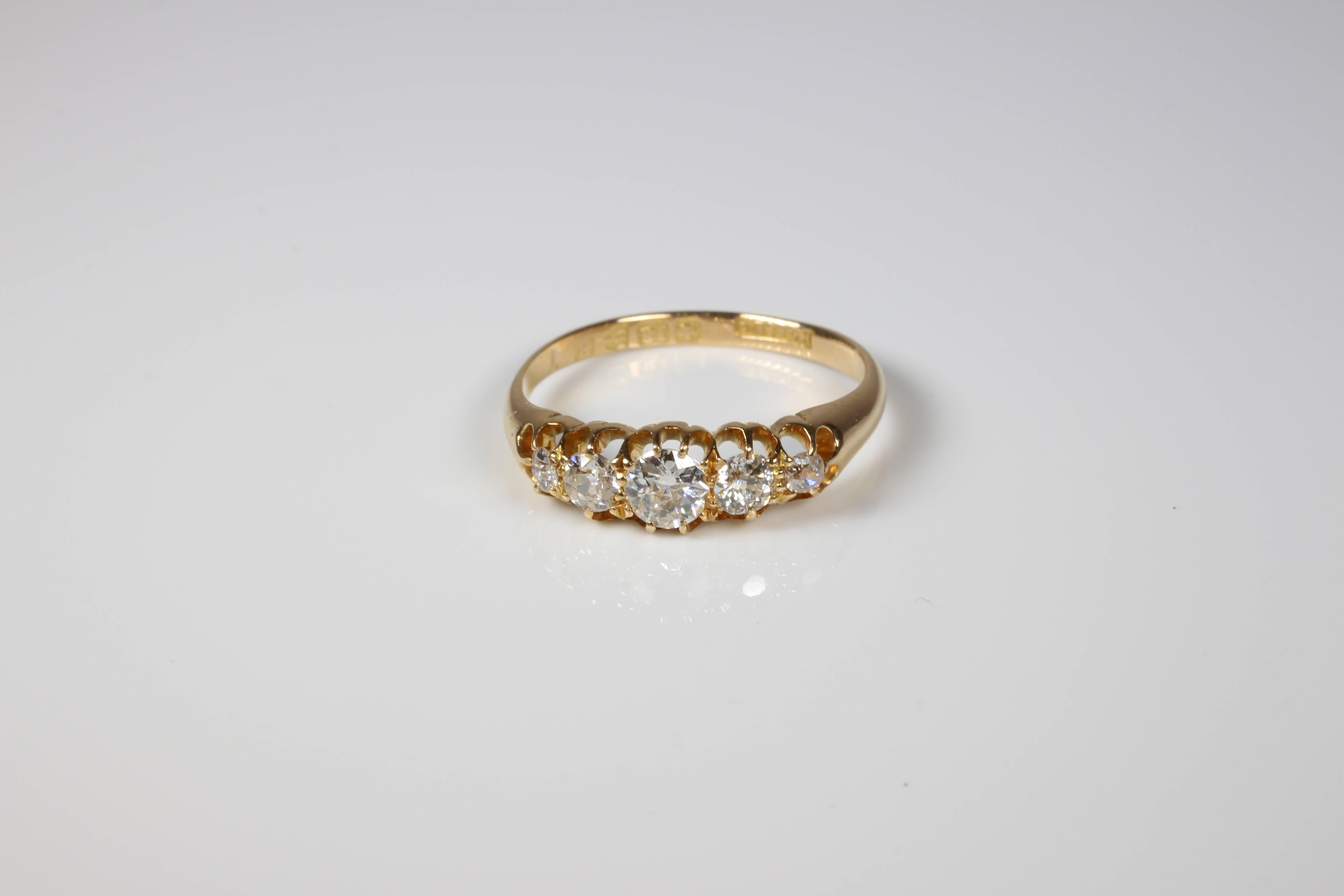 Antique 5 diamond ladies eternity ring. Set with 5 graduated old european cut diamonds of total approximate weight 0.59ct colour I with clarity SI-I1. Currently size M 1/2 (US=6 1/2) and will be safely sized by our expert jewellers free of charge if