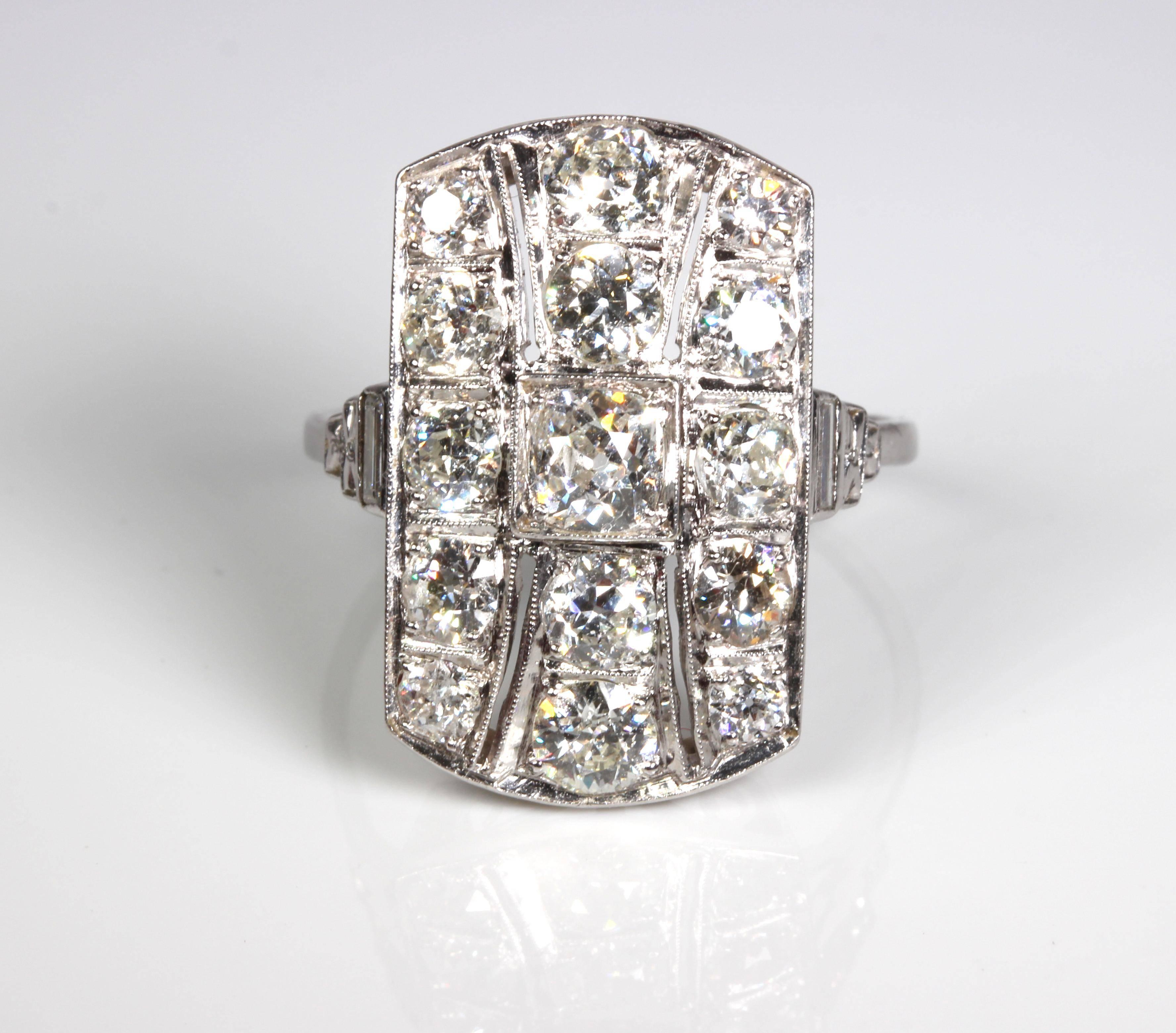 Original art deco platinum diamond dress ring. Absolutely superb and stunning -
 wear this and feel like royalty! Centre old cushion facetted cut diamond of 0.52ct I/SI with 4 diamonds in the centre row of 1.06ct and 10 diamonds in the 2 side rows