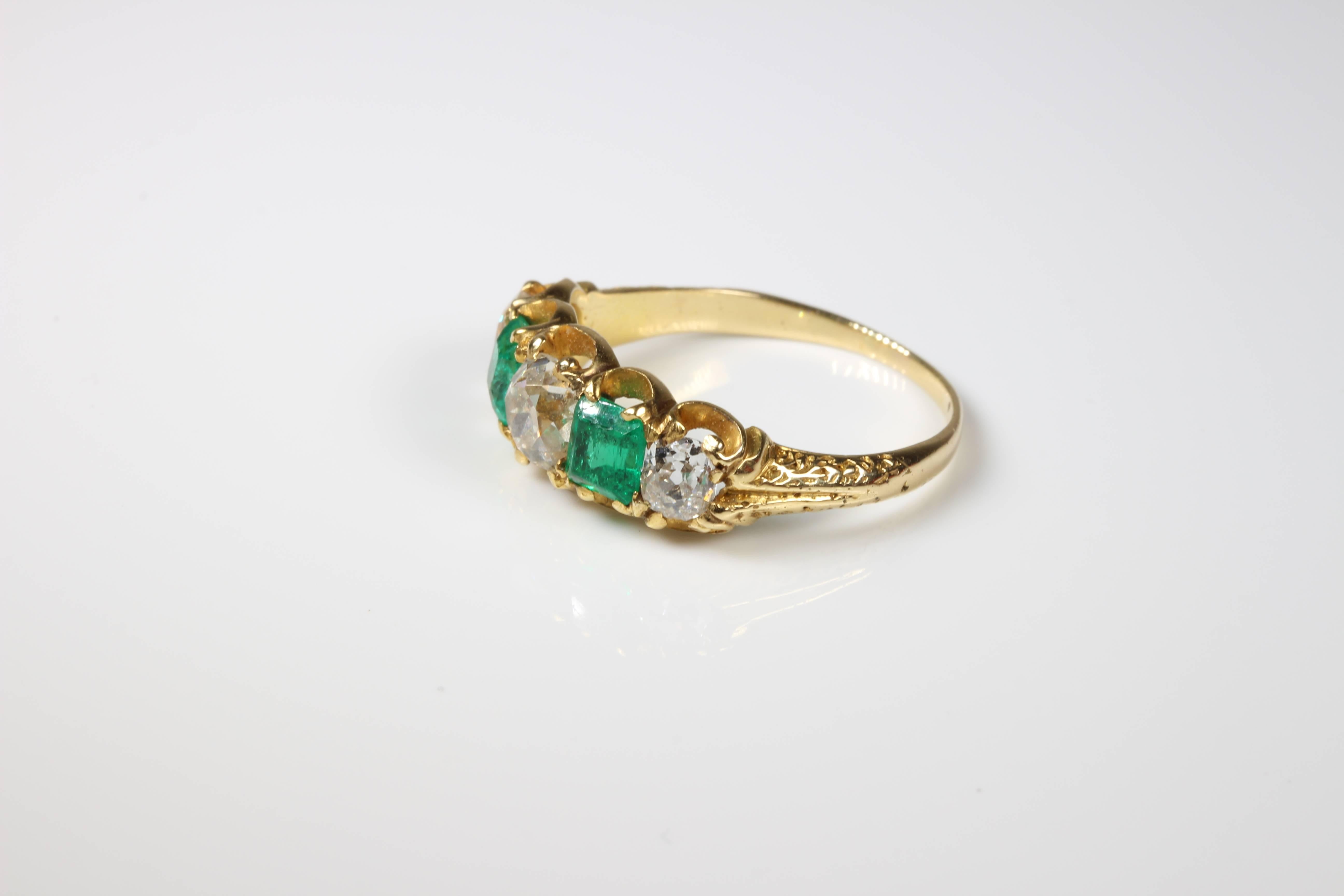 Victorian 18ct gold half hoop emerald and diamond eternity ring. So rare to find this design with emeralds. We love the superb colour of these emeralds too! Set with 2 old emerald cut natural emeralds and 3 old cushion cut diamonds of clarity VS,