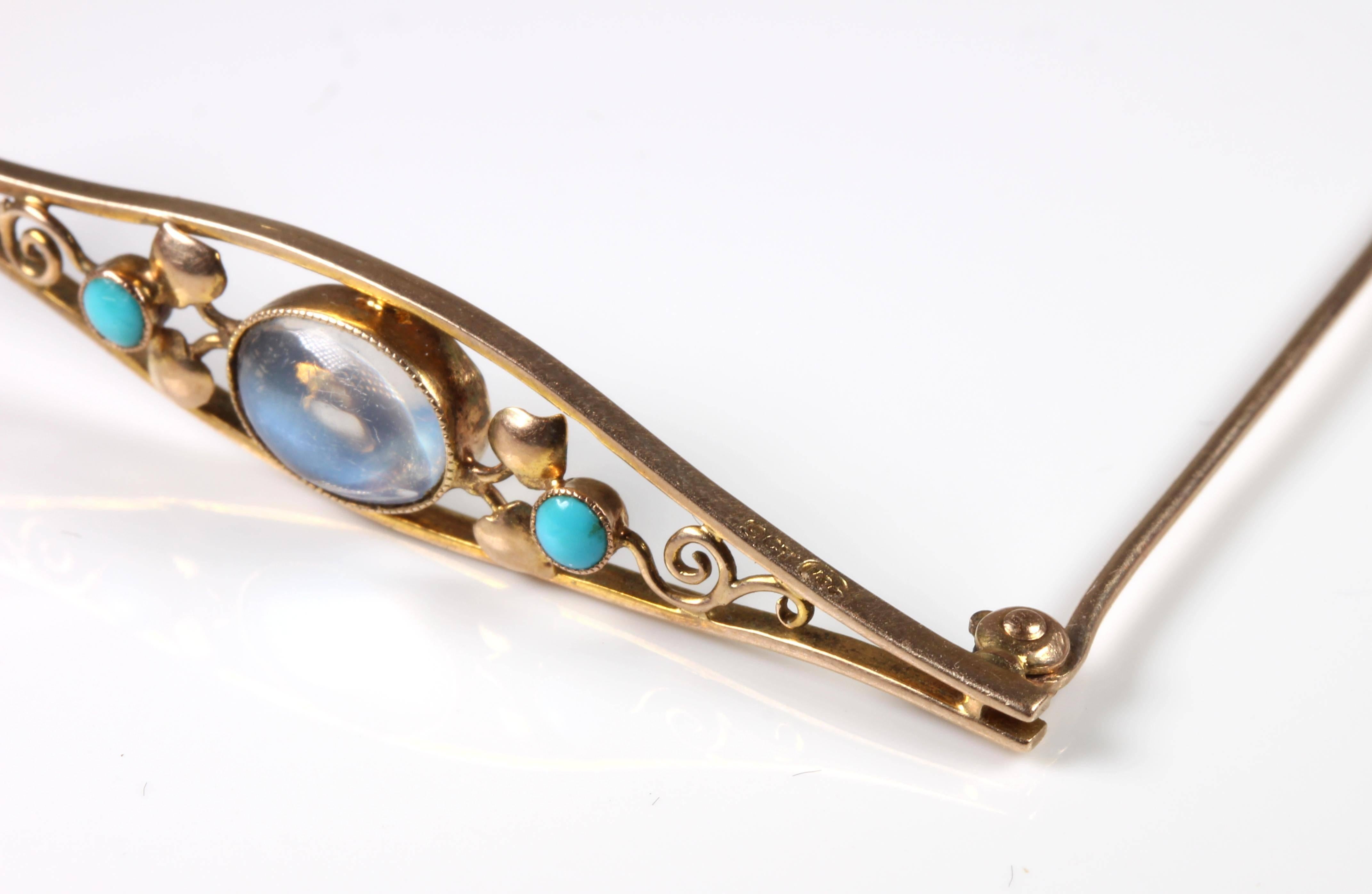 Murrle, Bennett and Co (1886-1914) were an Anglo-German design company based in Pforzheim, Germany. They produced pieces for Liberty of London. Gorgeous 9ct Gold Moonstone Brooch set with 2 round Turquoise and 4 gold tulips in a pleasing Art Nouveau