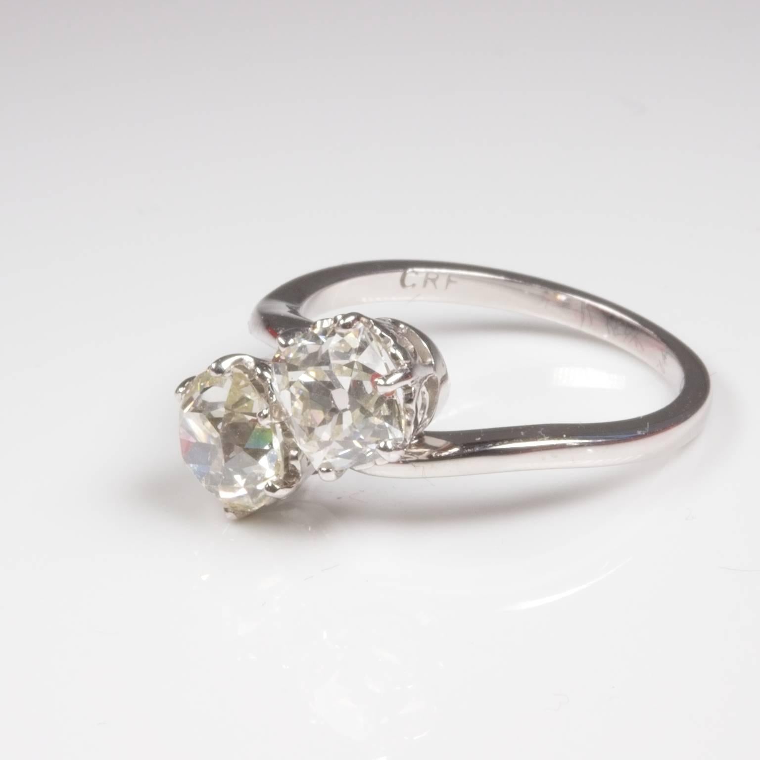 Romatic Toi et Moi (You and Me) 2 Diamond ring in 18ct white gold set with 2 nicely matched old mine cut diamonds of 1.11ct J/VS2 and 1.13ct I/VS1. Lovely heart cutouts on the crown. Total diamond weight 2.24ct. Currently size M (US=6 1/2) and will