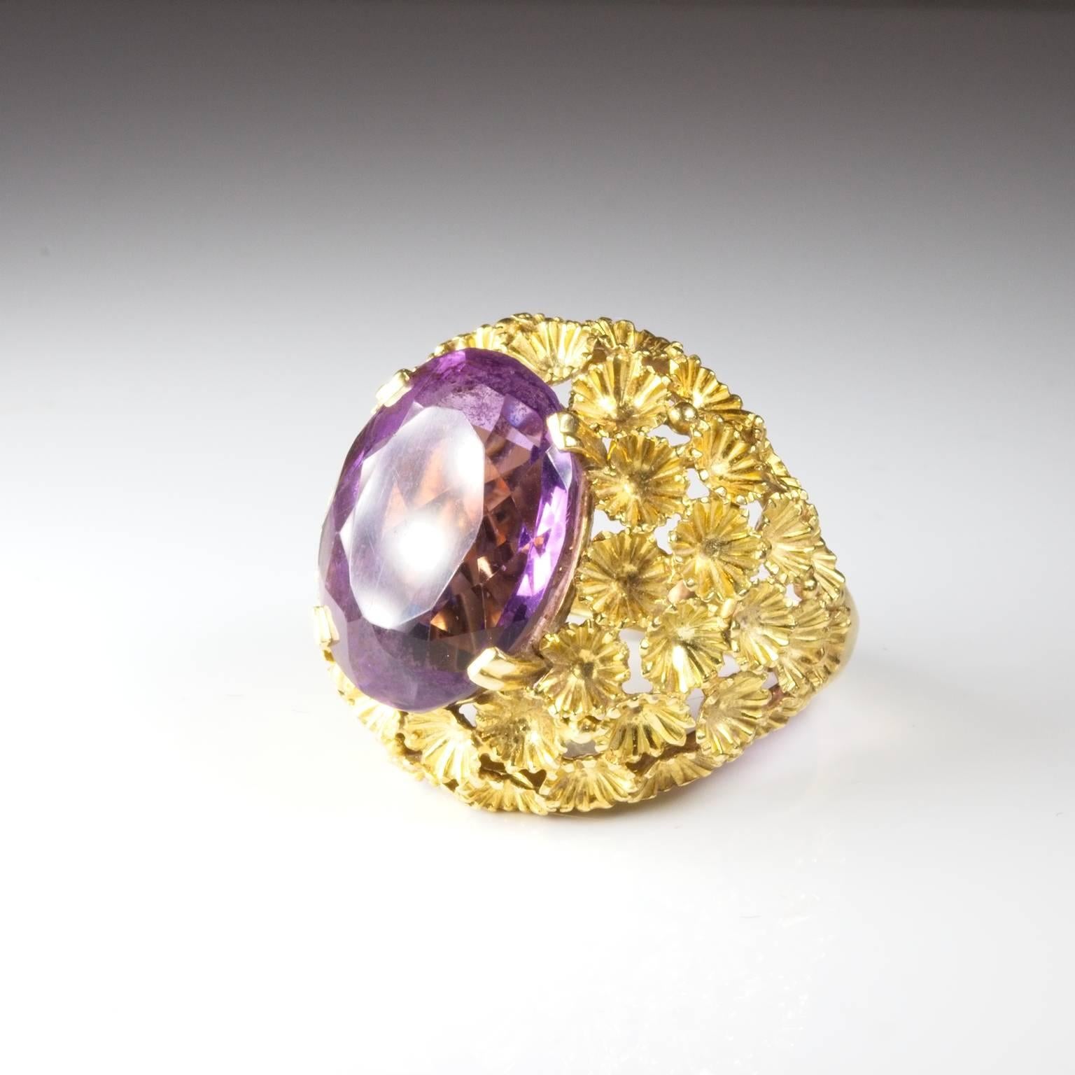 Stunning bold amethyst ring set with complex floral designs in 18ct Gold. French Hallmarks. Stone measures 18mm x 13mm x 9mm.  Currently size O (US = 7) and will be safely sized by our expert jewellers free of charge if required. 18ct, French,