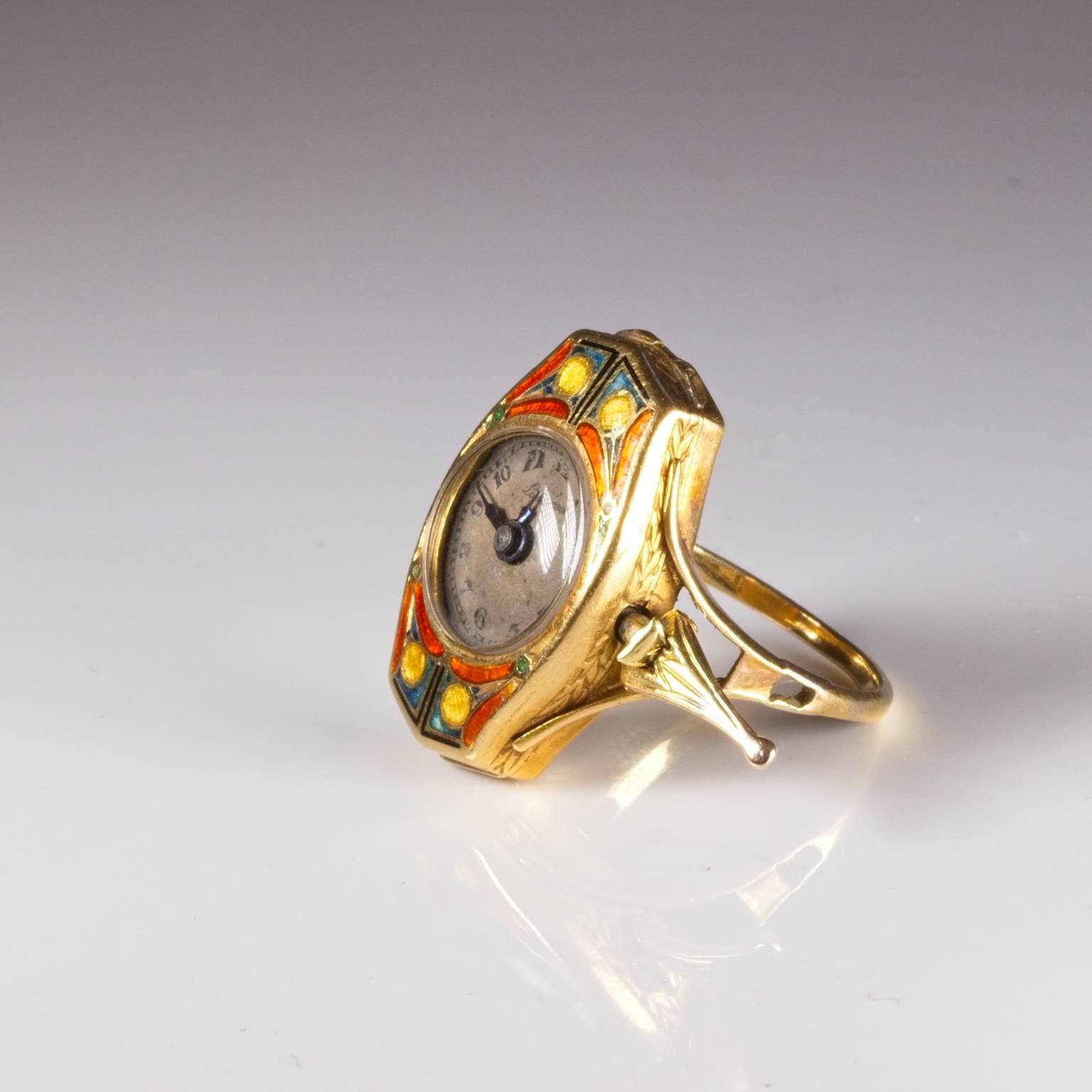 Stunning ring watch by Lusina in 18ct gold with enamelling and classic art deco styling featuring a hidden crown. Has been serviced. Currently size M (US=6) and will be safely sized by our expert jewellers free of charge if required. Engraved: From