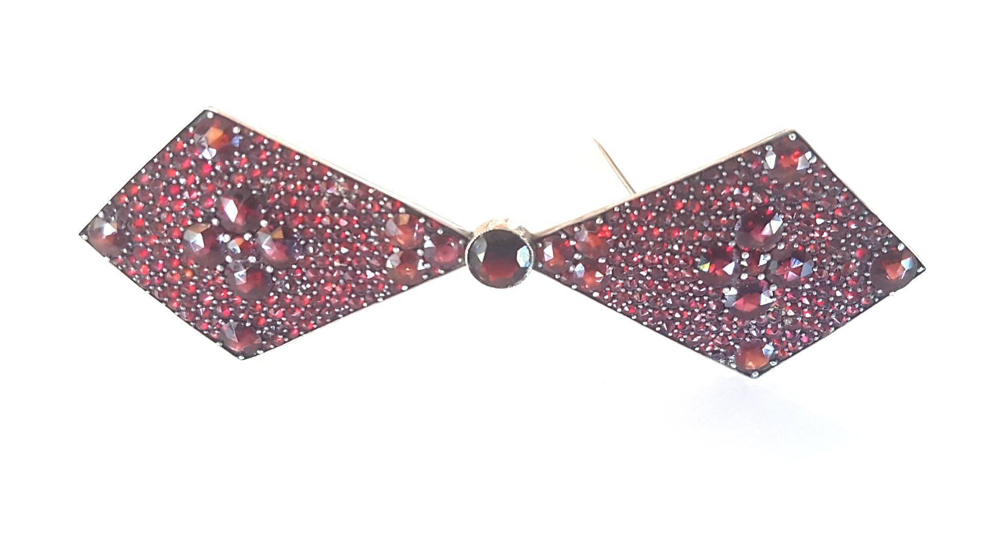 If you were born in January your birthstone is GARNET - used by travellers for protection and to light up the night. Stunning Bohemian Garnet Bow Tie Brooch of large proportions perfect for New Year's Eve! Measures 11cm x 3.5cm. This item is unique