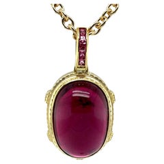 Rubellite Tourmaline Cabochon Pendant with Pink Spinel in Yellow Gold, 81 Carats