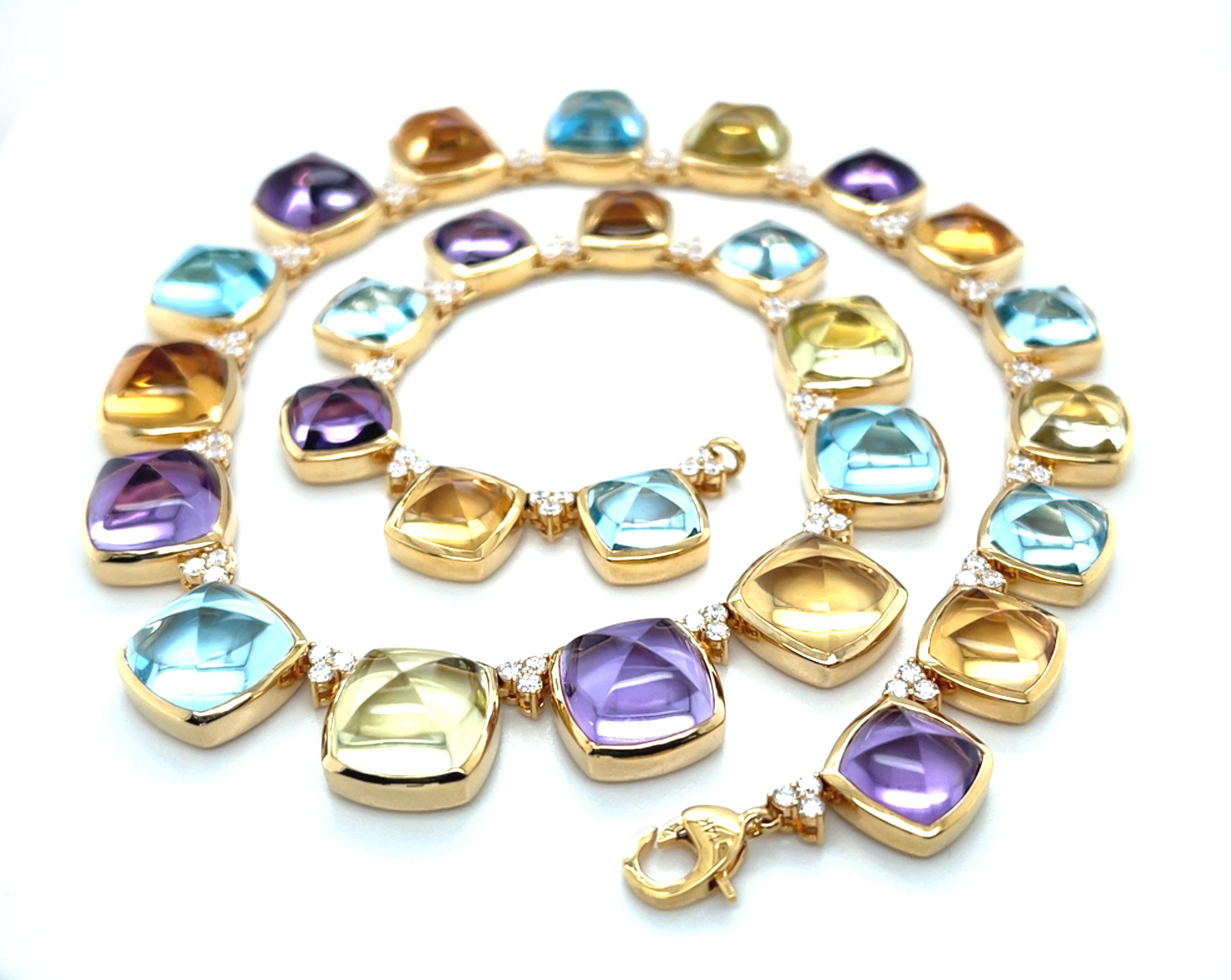 Ce superbe collier présente une collection de 27 pierres précieuses, dont l'améthyste, la citrine, la prasiolite et la topaze bleue, façonnées sous forme de cabochons en 