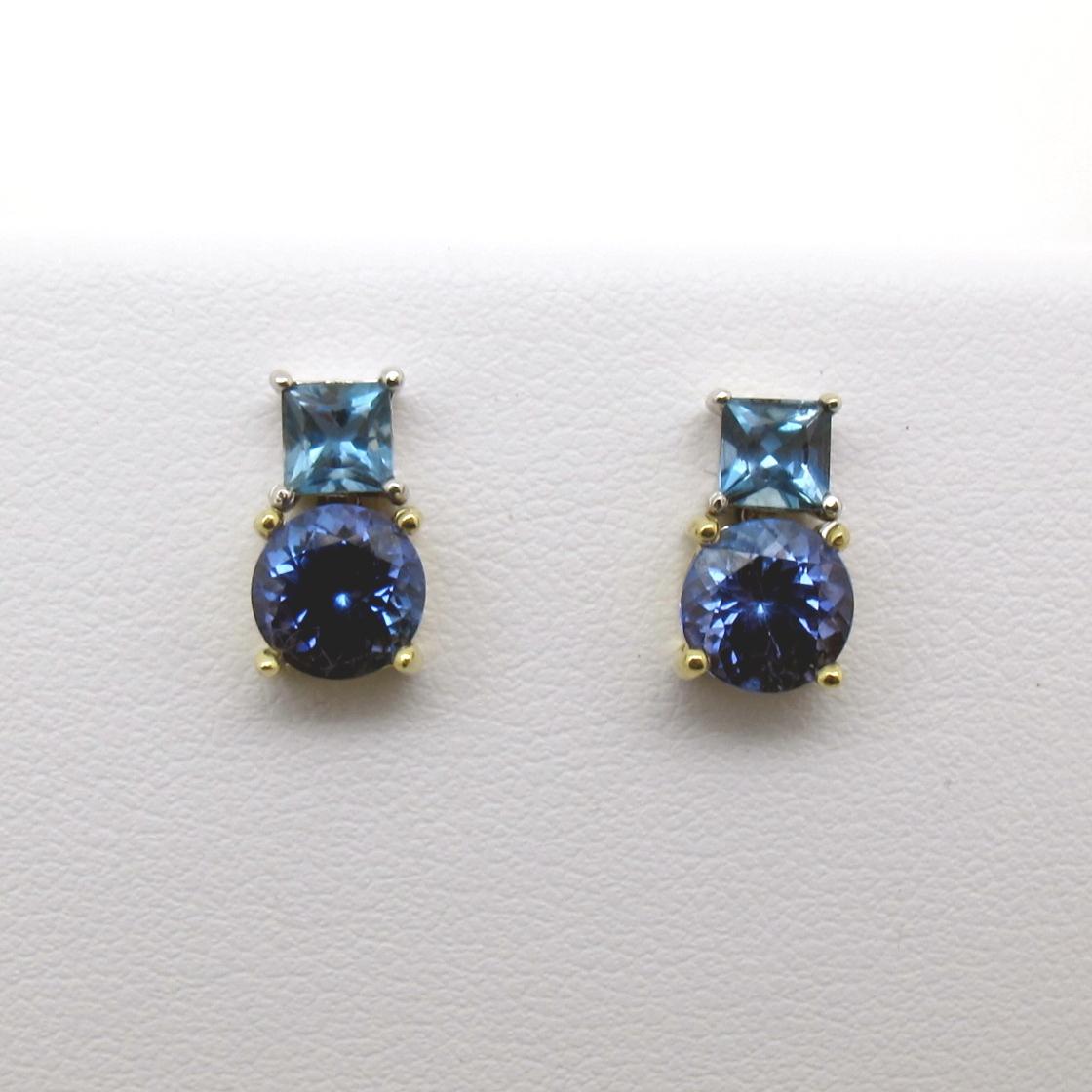 A combination of  violet colored tanzanites and  deep aqua-blue aquamarines make a lovely color pairing in these beautiful earrings. We use only gemstones of  fine color, cut and clarity.  The tanzanites measure 6.5mm in diameter and weigh a total