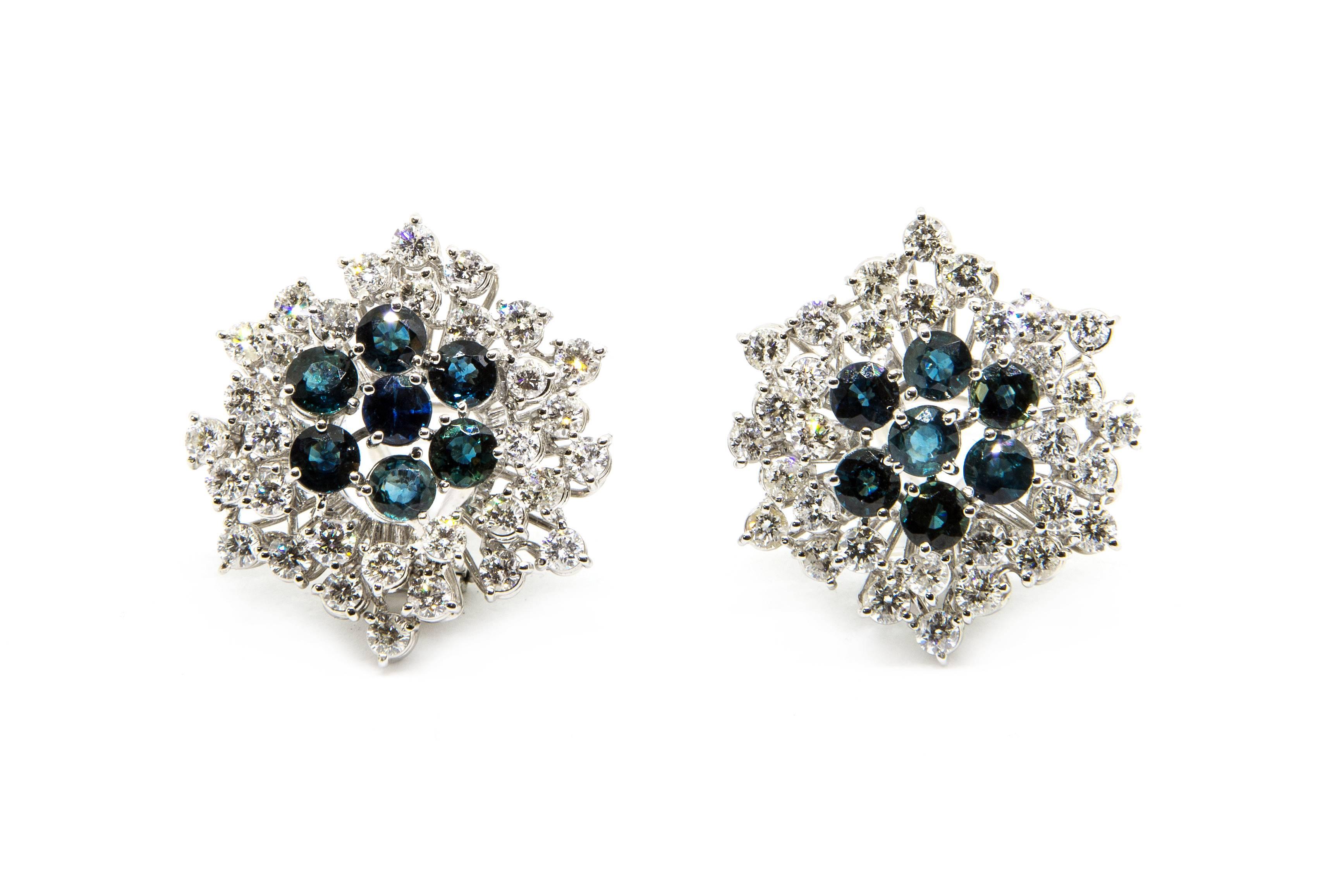 A pair of 18K white gold clip and pin cluster earrings set with sapphires and diamonds.

	•	64 brilliant cut diamonds of approx. 3.2 ct
	•	14 sapphires of 4 mm each
	•	Overall weight 18 grams

