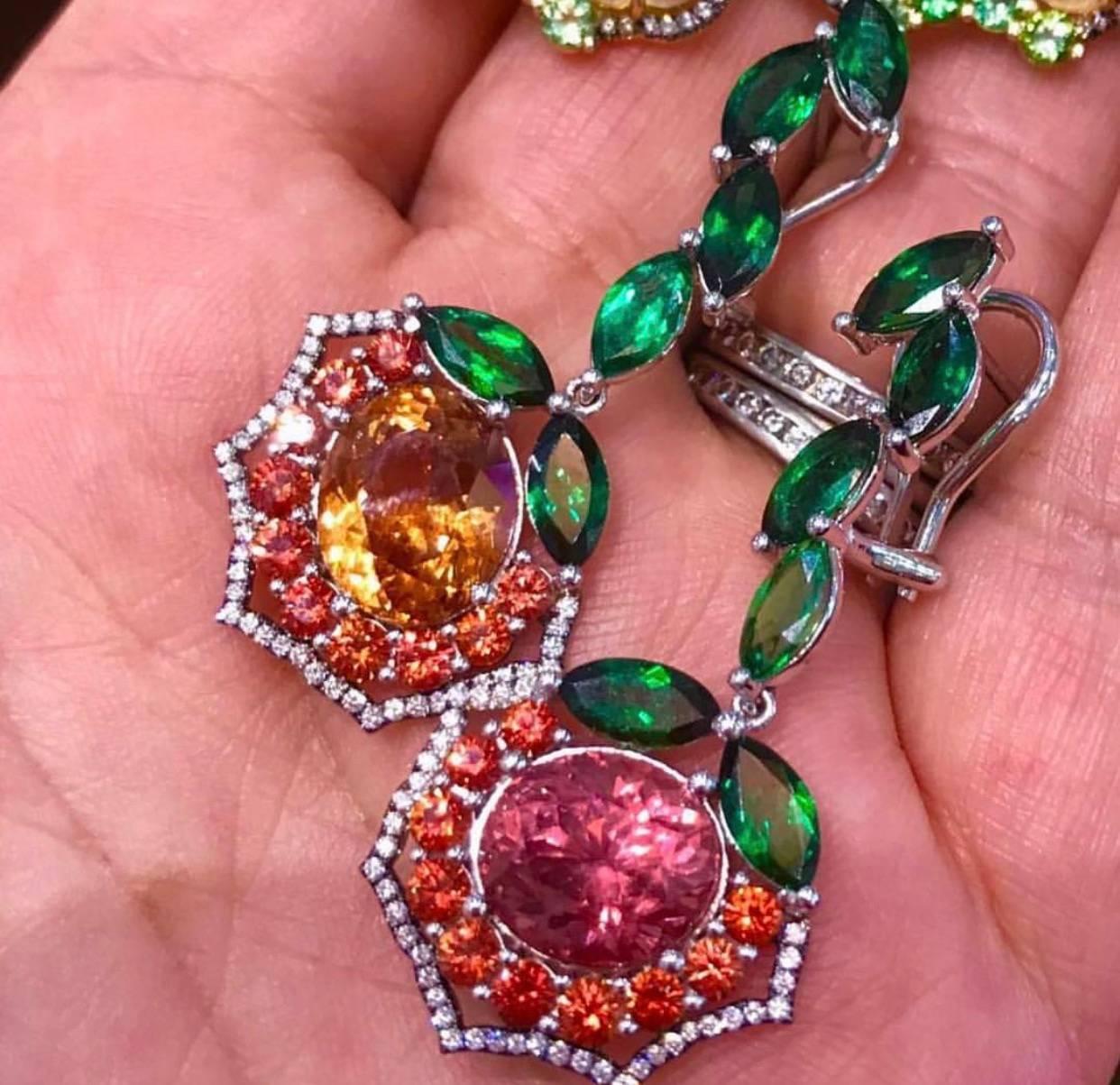 18 K White gold earrings have very rare in color and size: Malaya Garnets, from Tanzania, Pink and Peach oval gems are perfectly match by cut and size, and two colors do compliment each other, they sparkle like only Garnets can. Accented with Marque