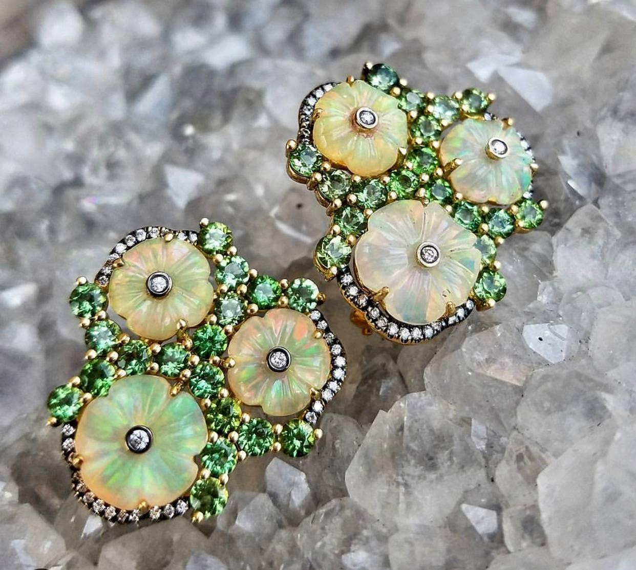 Exquisite Carved Opal Earrings are Romantic and feminine Work of Art, Inspired by past Jewels, Masterfully Carved Opal Flowers showing, Green, Orange , Yellow and Red Color Flashes, Looking Magical Surrounded by Mint Green Garnets and Colorless