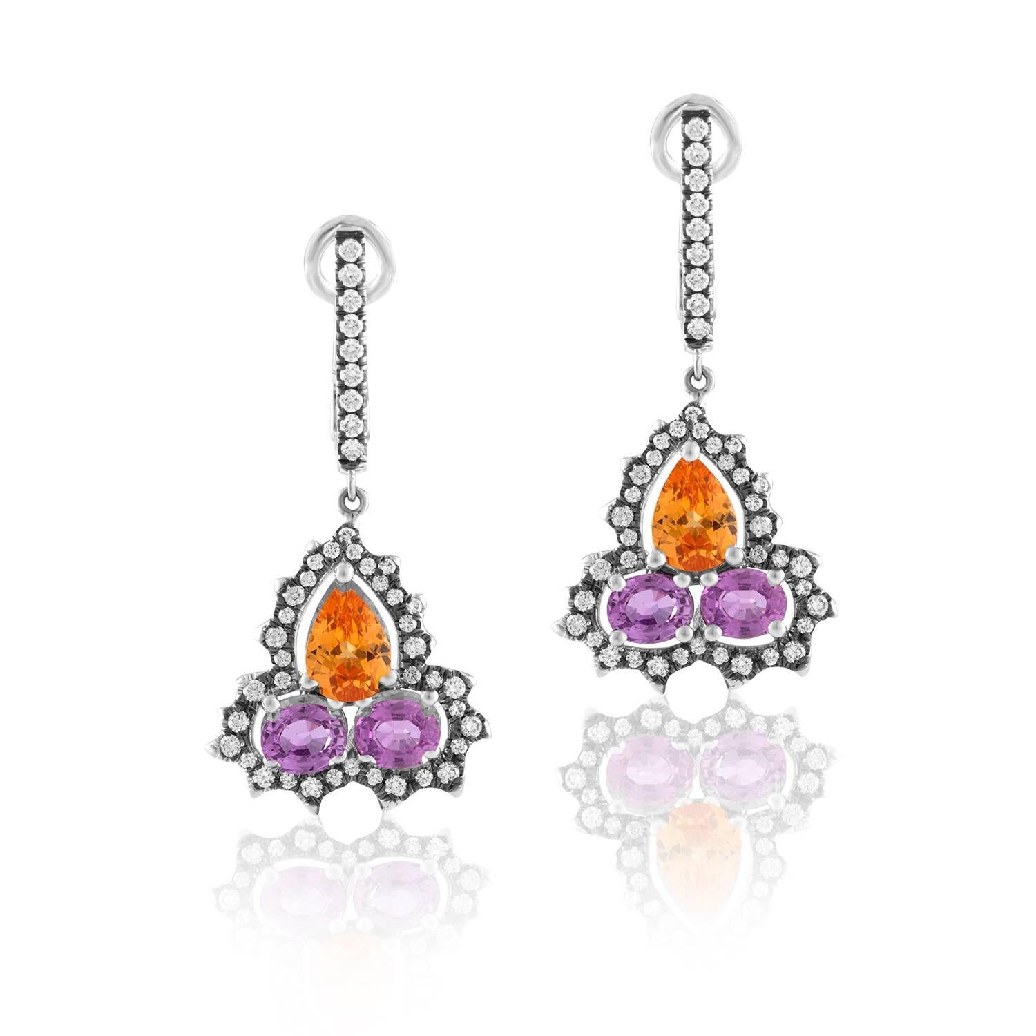 The 18 K white Gold Dangling Earrings, with Mandarin Garnets, Purple/Pink Sapphires and green Garnets, are dynamic earrings by Bella Campbell for Campbellian Collection 