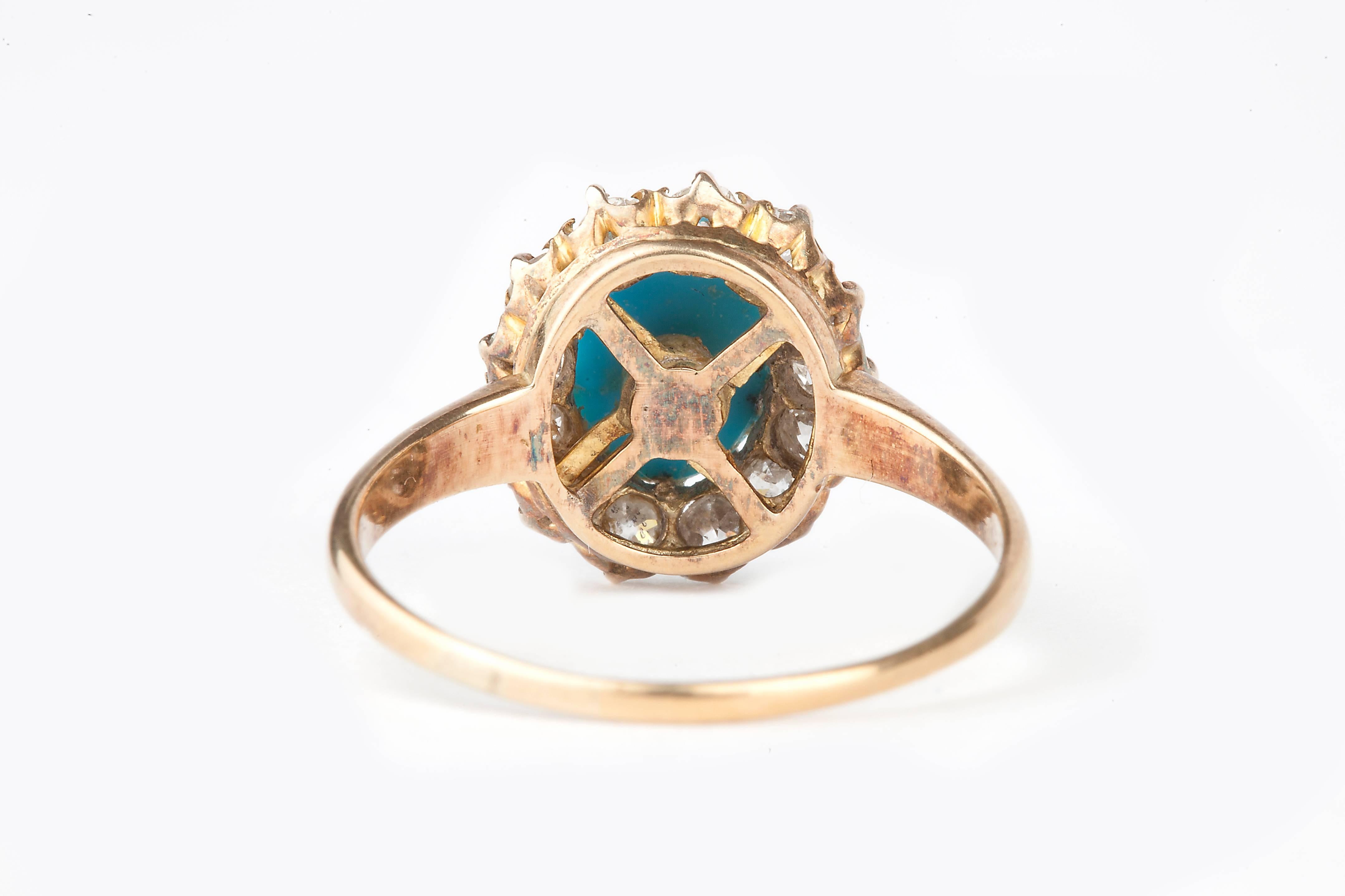 An diamond and turquoise 18k gold Victorian ring, natural Persian turquoise surrounded by 13 rose cut diamonds.  