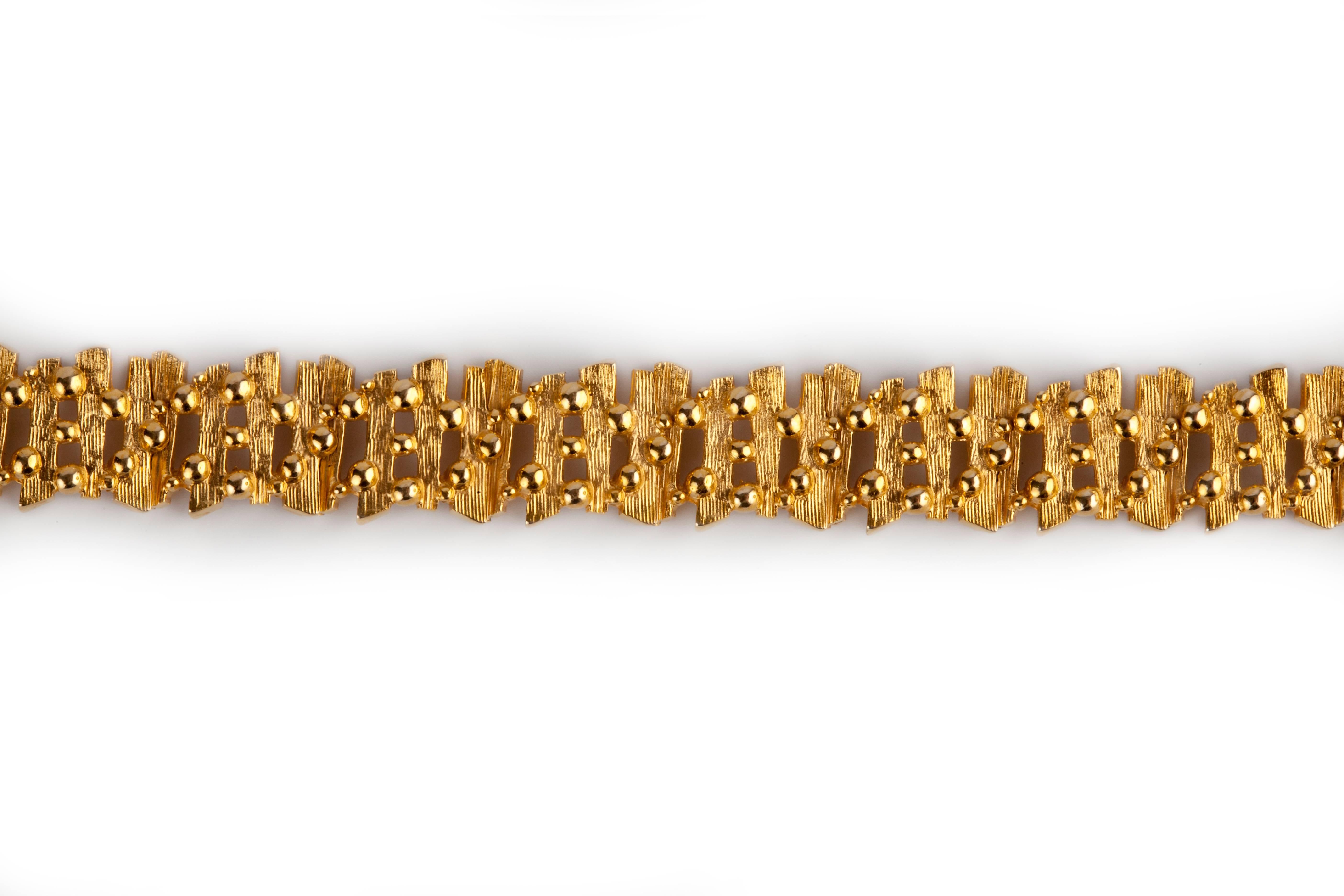 A bark effect 9k gold 1970s bracelet, made by the goldsmiths David Shackman and Sons, who were working in london during from the 1950s onwards.  They also made watch straps for Rolex and cases for them too, at a time when rolex would send the
