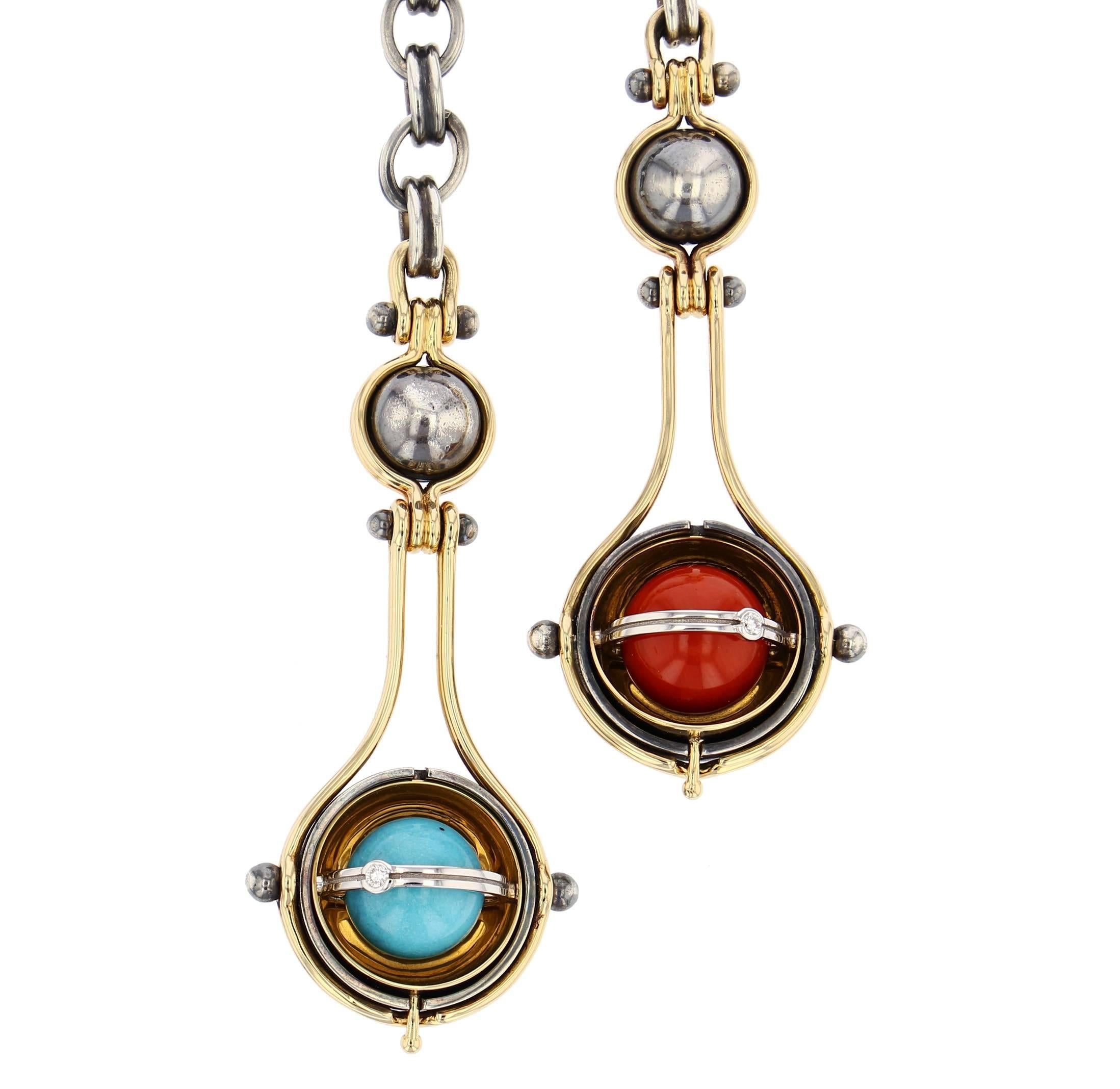 Elie Top Mecanique Celeste 2 Drops Necklace, Gold, Coral, Turquoise, Diamonds

Tie necklace with a patinated silver chain. The two drops comprise two yellow gold threads around a patinated silver globe supporting a mobile structure. This in turn