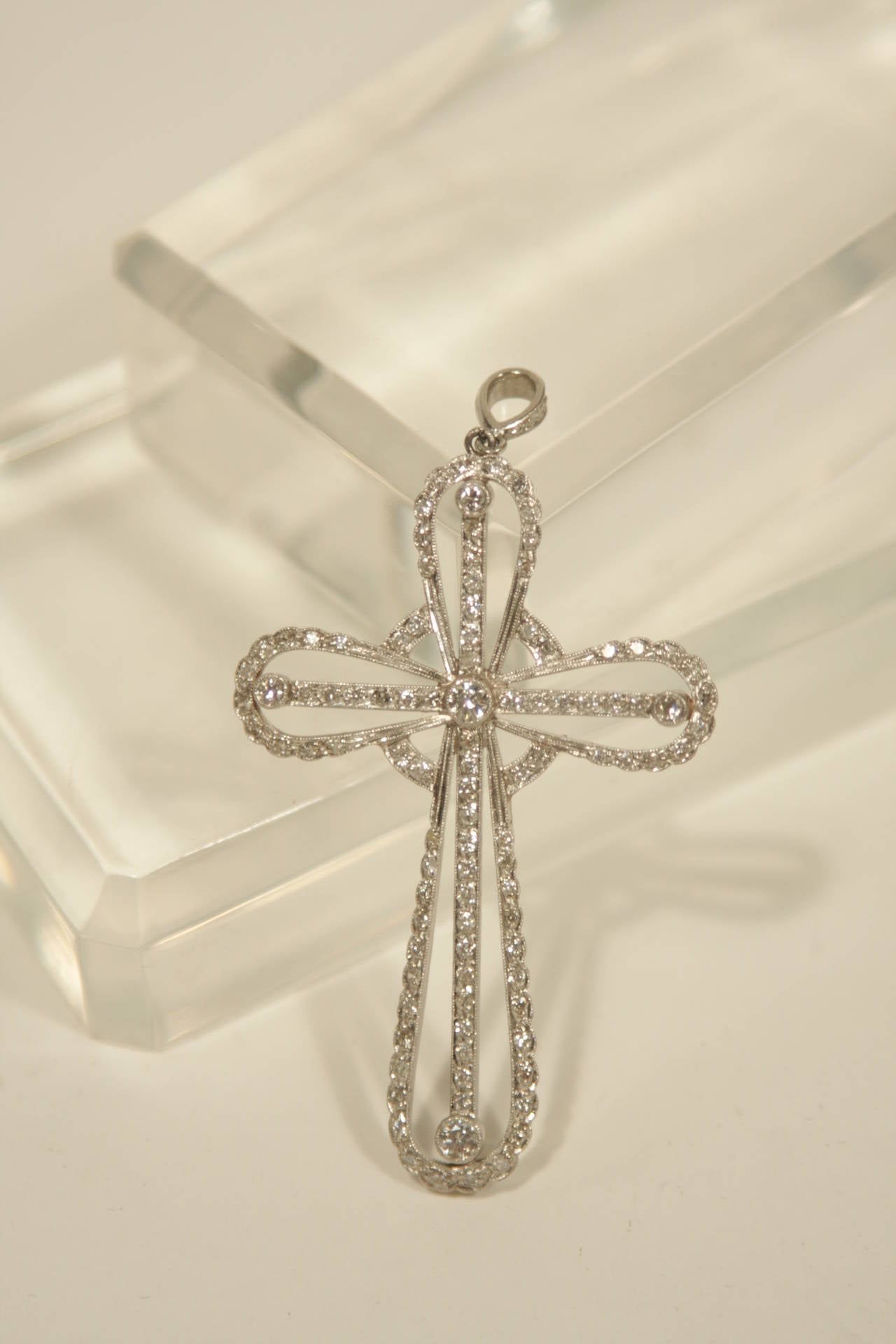 This exceptional cross is available from The Paper Bag Princess of Beverly Hills. The cross is composed of Platinum and is accented with diamonds. This pendant is photographed with a chain; the chain is sold separately. 

Measures