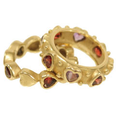 18 kt Gold bands with Garnet and Amethyst heart setting