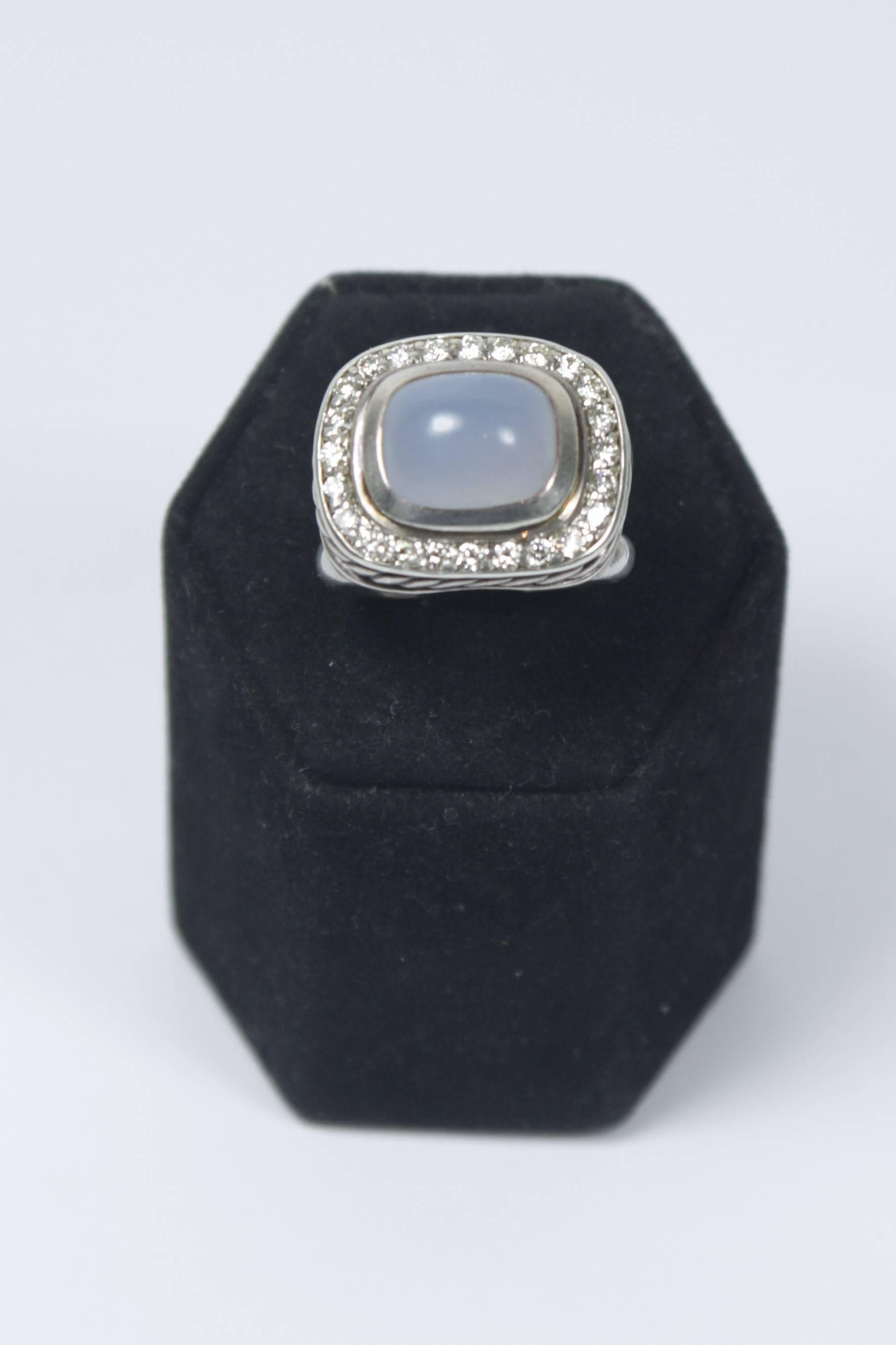 This David Yurman ring is composed of sterling silver with pave diamonds and features a cabochon moonstone (approximately 4 carats total weight). In excellent condition.

Specs: 
Sterling Silver 
Cabochon Moonstone
Pave Diamonds
Size: 7.5
