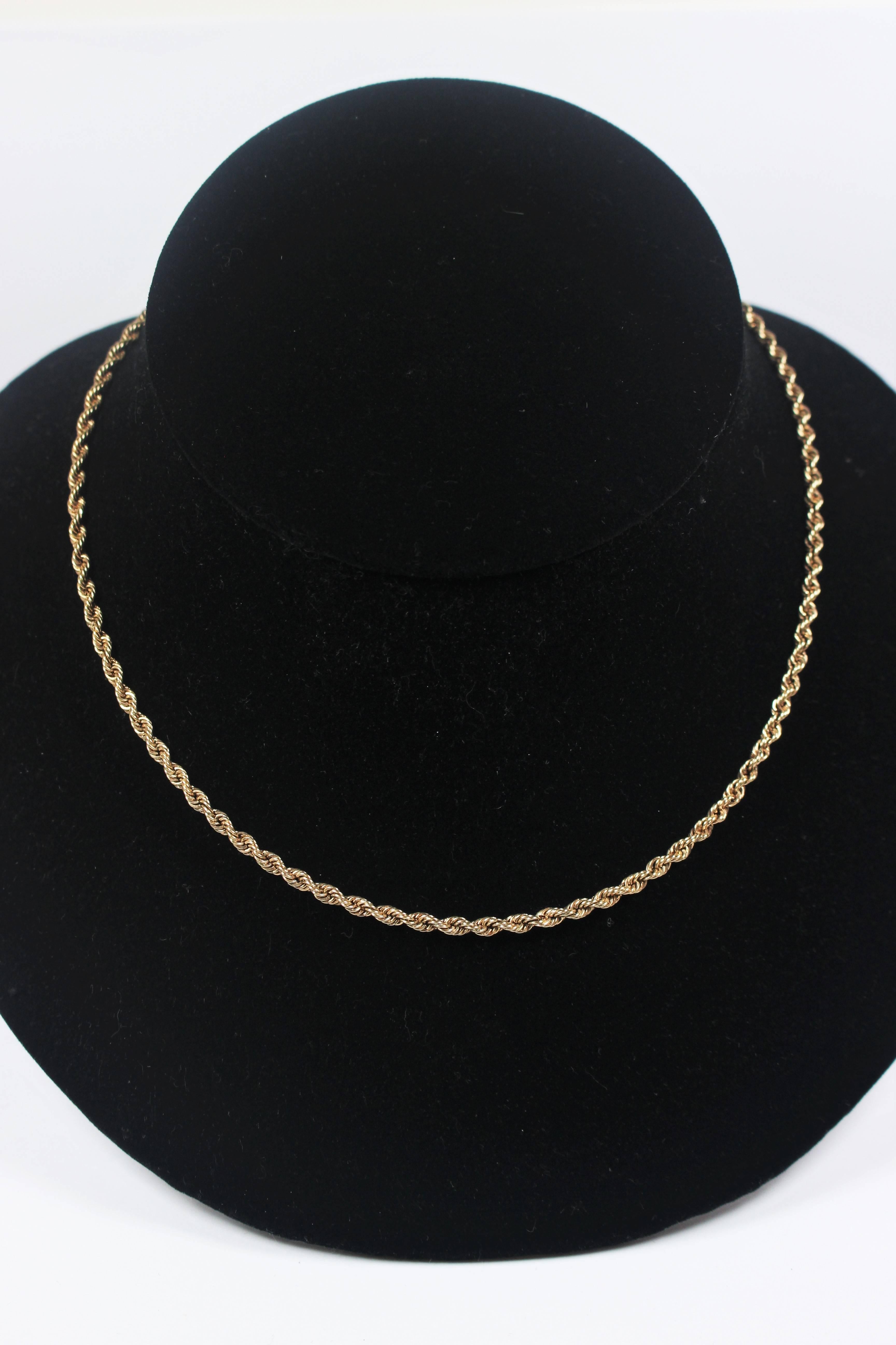 This necklace is composed of 14KT yellow gold. Features a rope design with clasp closure. In excellent vintage condition.

Specs: 
14KT Yellow Gold
Length: 20