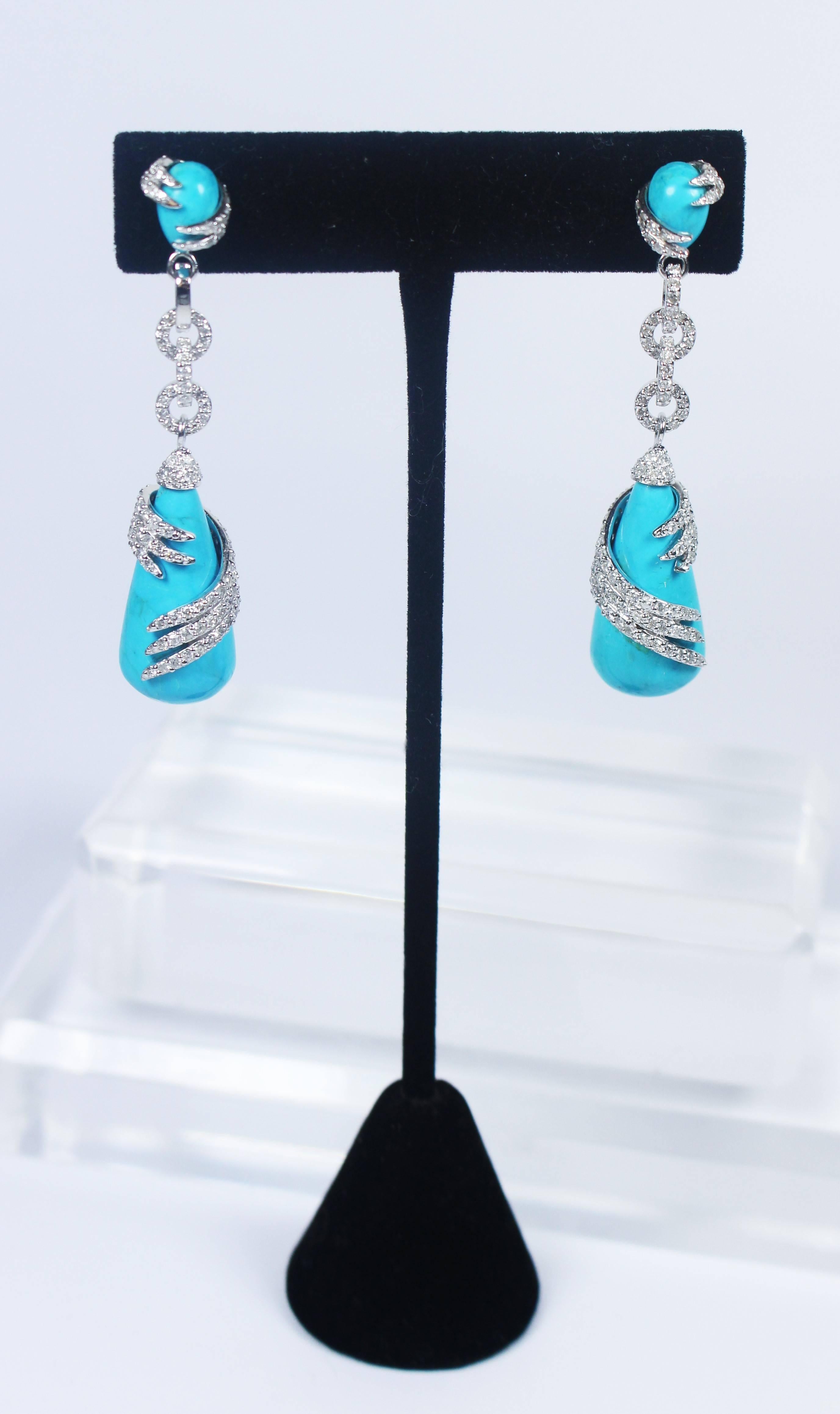 These earrings are composed of 14KT pave white gold with turquoise. In excellent condition.

Specs: 
14KT White Gold, Turquoise  
Length: 2.25